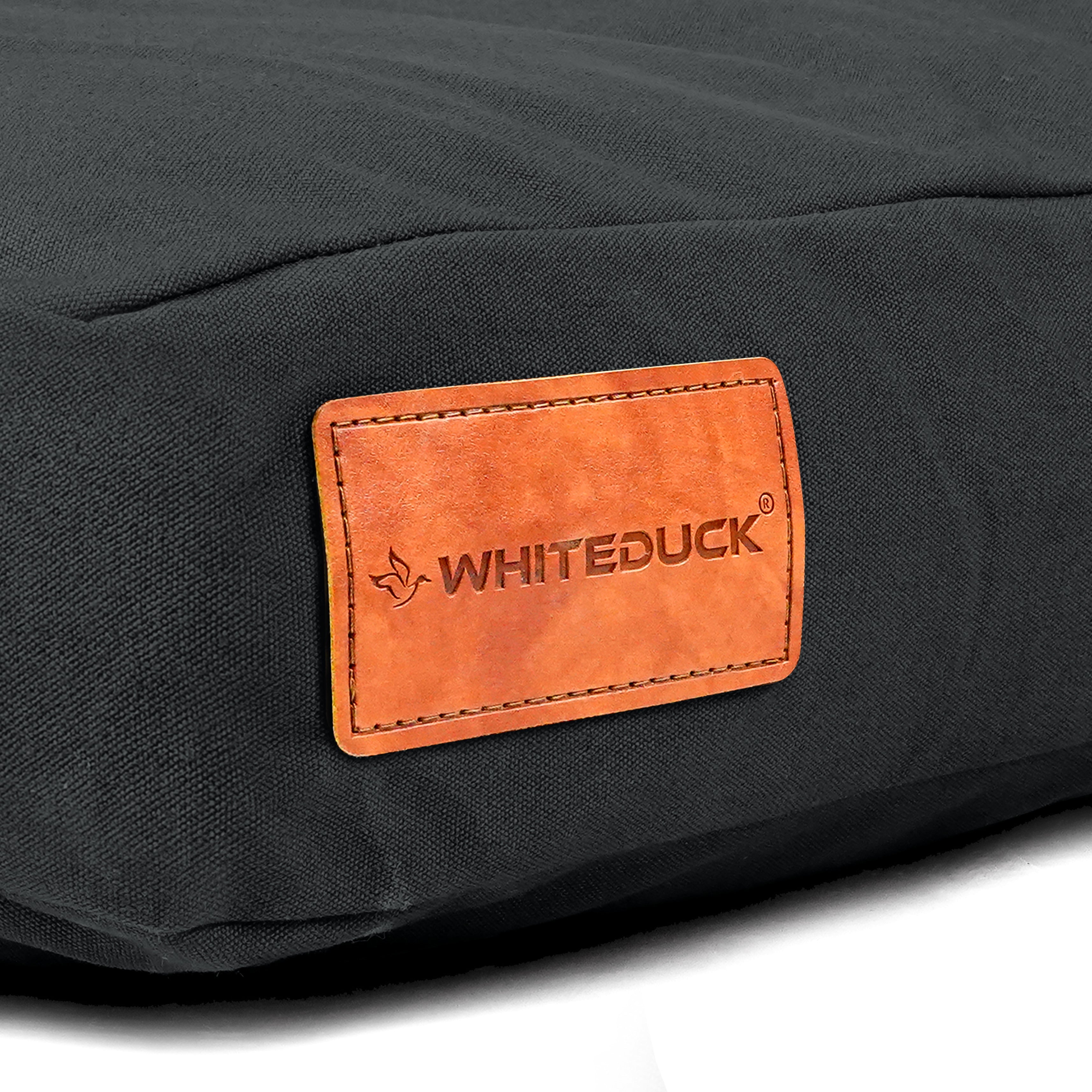 White Duck Outdoors pet dog bed with plush fabric and cushioned sides, designed for comfort and support for dogs.