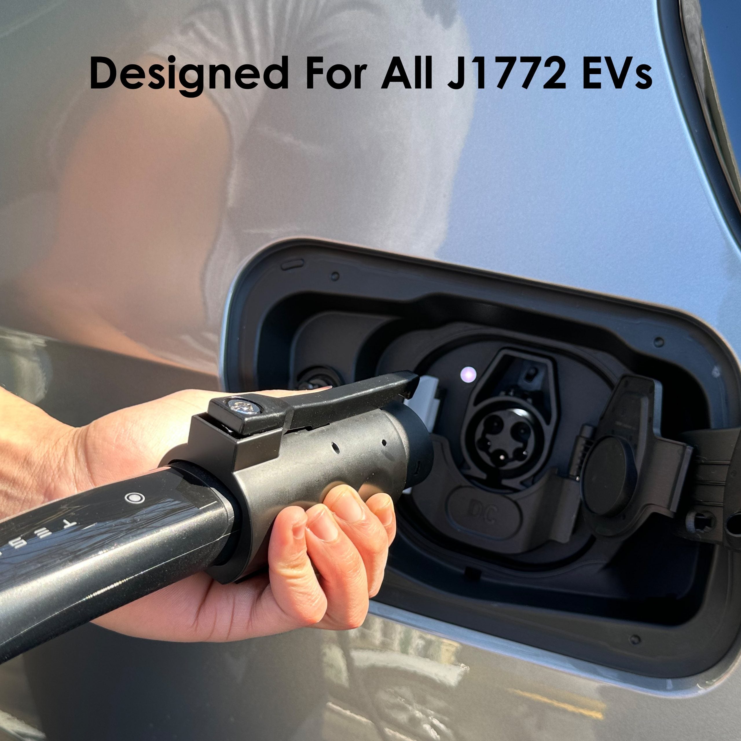 Rexing Tesla to J1772 EV charging adapter connected to a vehicle, showcasing the compact, durable design for electric vehicle charging.
