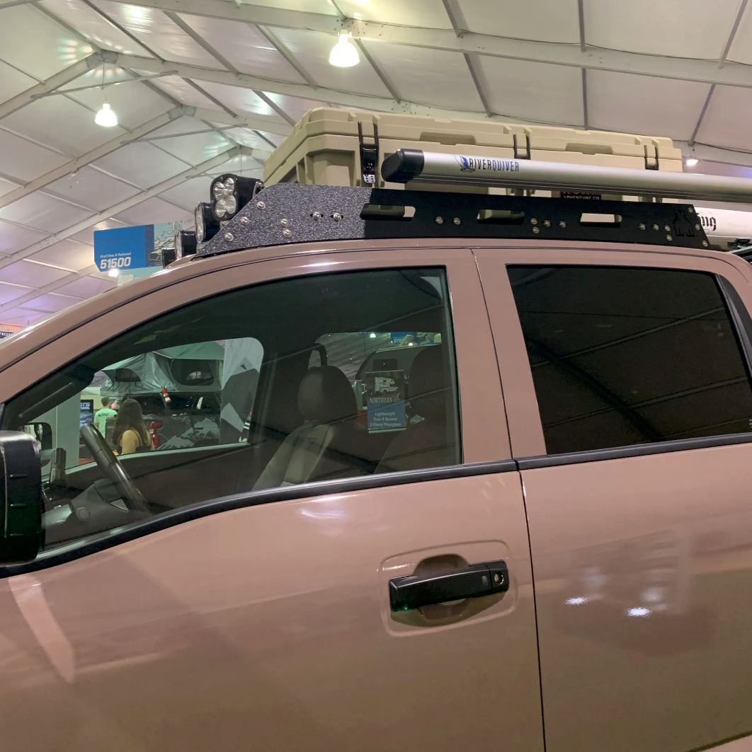 Nissan Titan truck with Avatar Offroad roof rack installed, showcasing durable custom roof rack for cargo storage.
