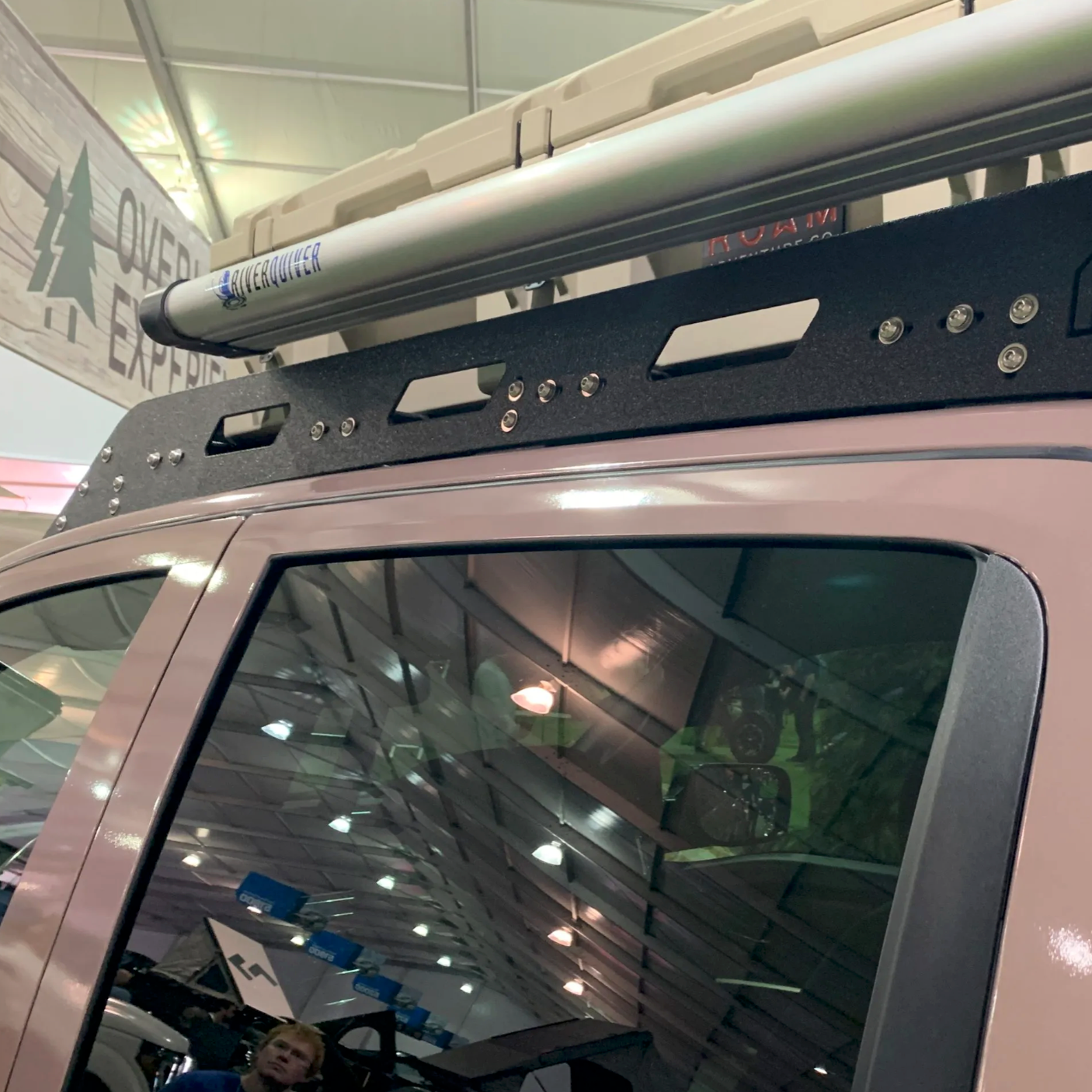 Nissan Titan truck with avatar offroad custom roof rack installed on top, showcasing sturdy metal construction and mounting points