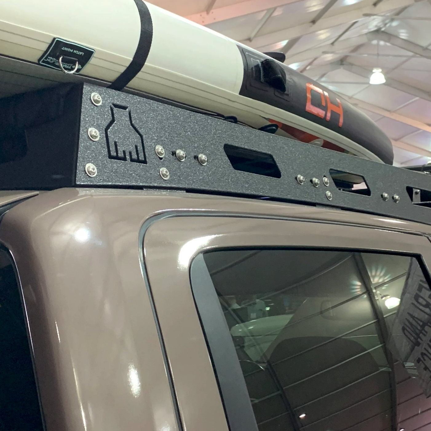 Nissan Titan truck with Avatar Offroad custom roof rack installed on the roof for added storage and utility.