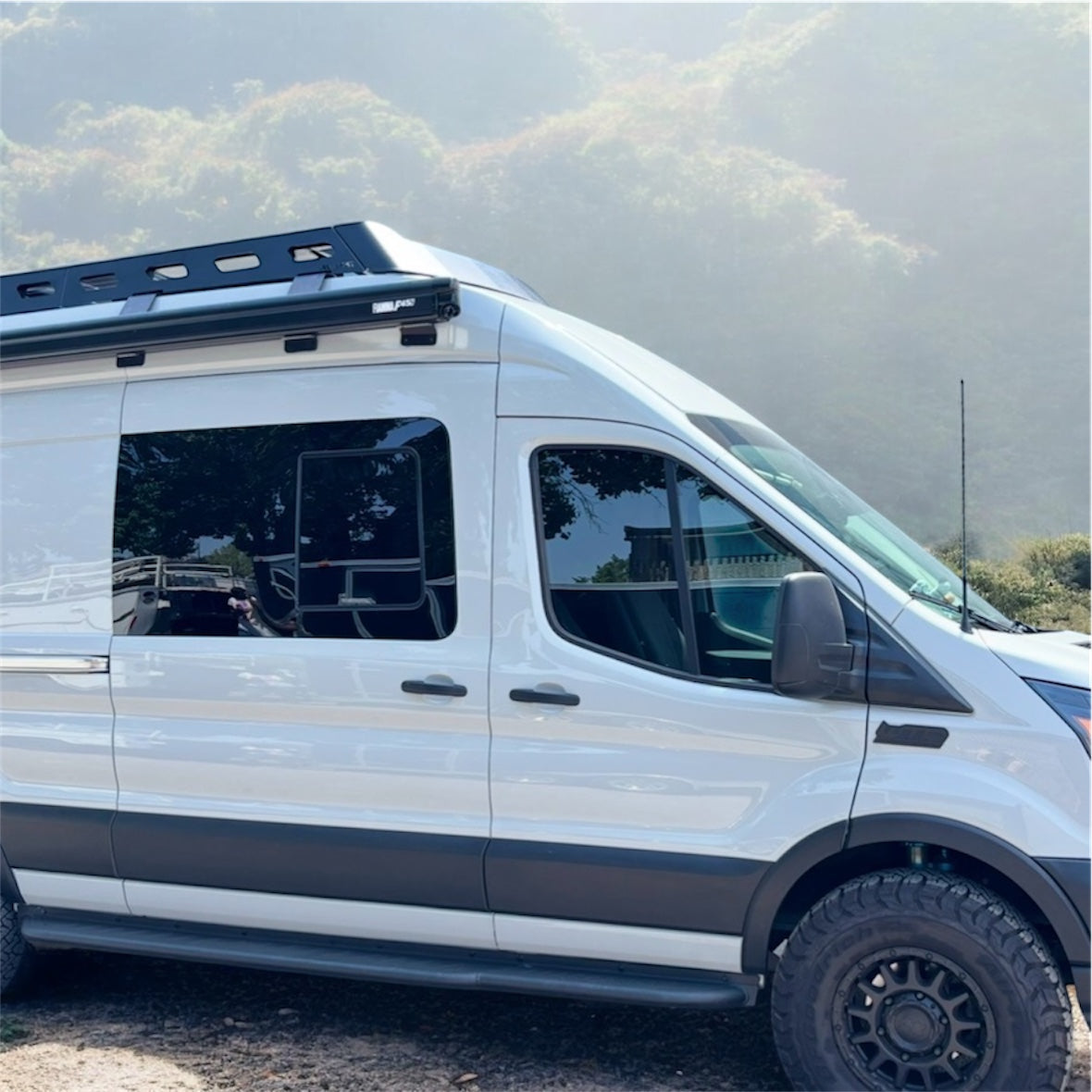 Avatar Offroad Ford Transit Rockbody side steps mounted on a van, providing easy access and a rugged look.
