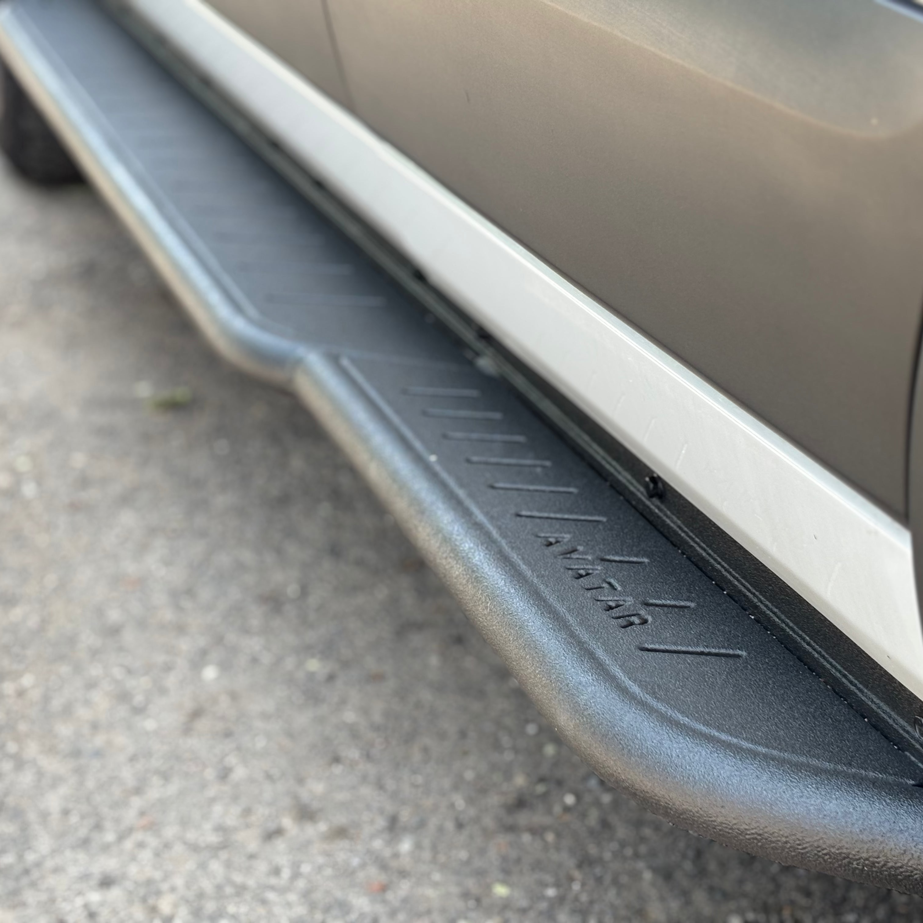 Avatar Offroad Ford Transit Rockbody Side Steps installed on the van, showing sturdy black side step bars along the vehicle's side.