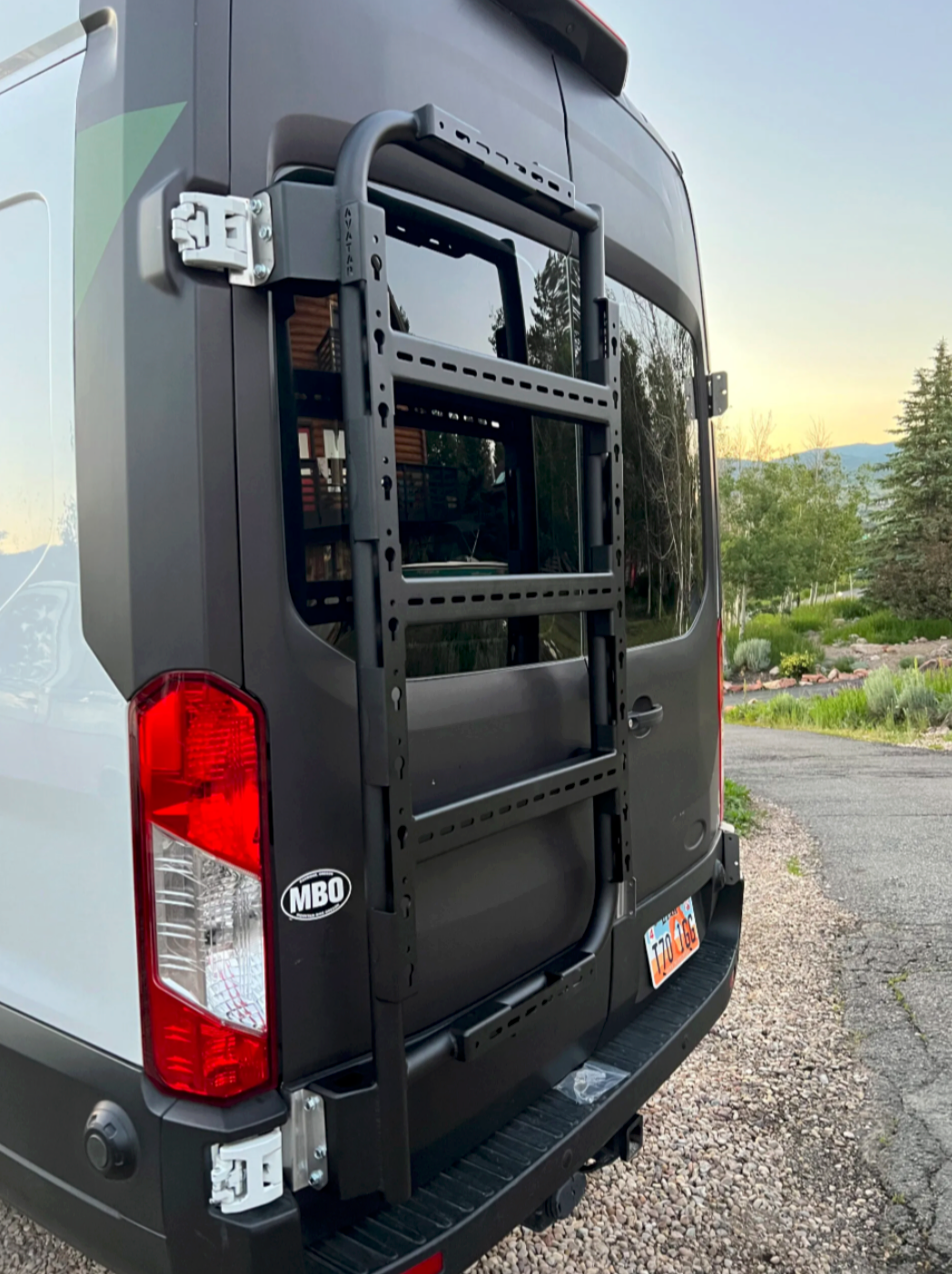 Avatar Offroad Van Rear Door Storage Mount installed on a Transit van, showcasing sturdy mounting system for organized cargo.