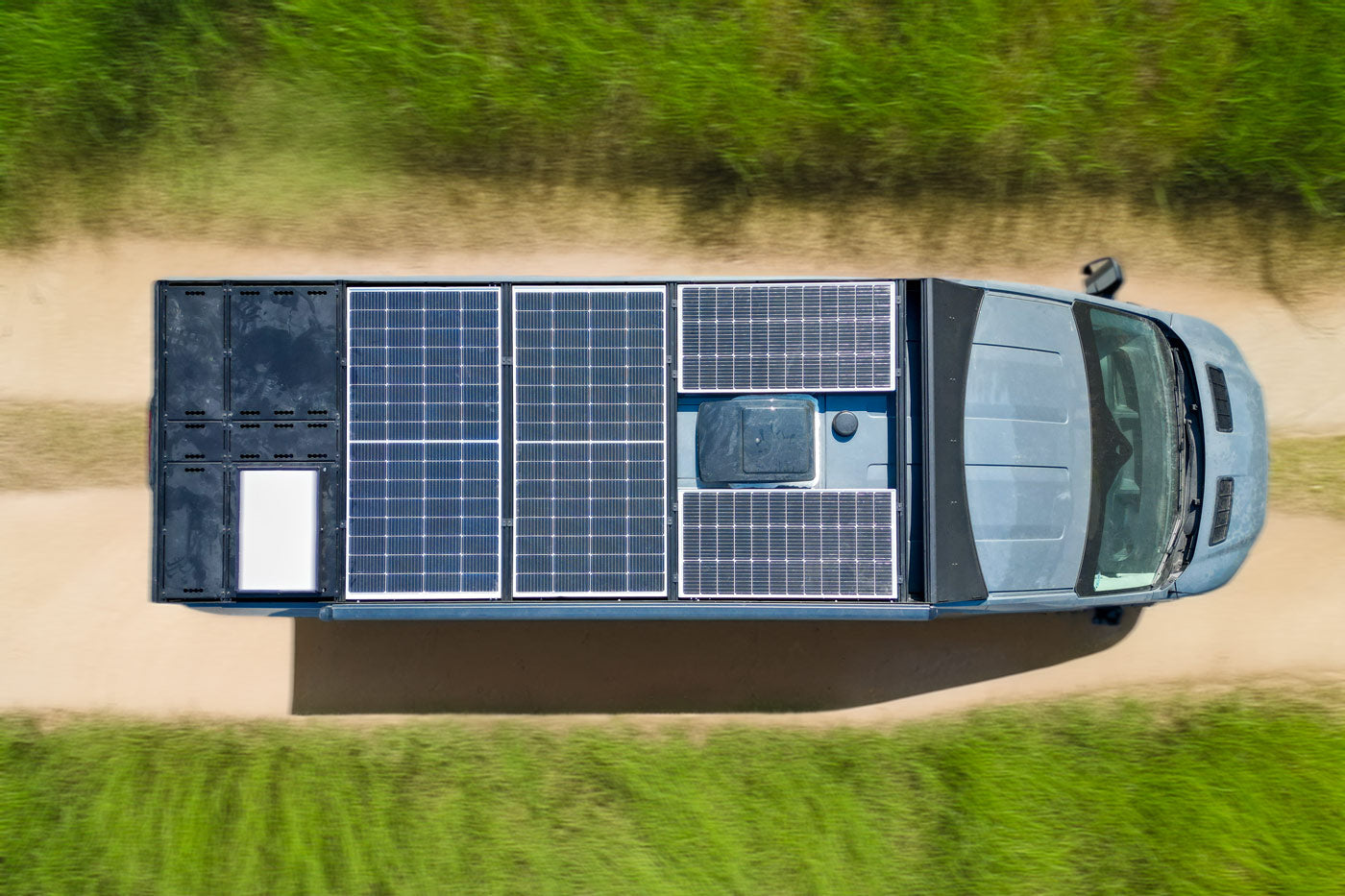Transit Roof Deck Panels 2.0 with flush hardware by Orion Van Gear mounted on a Ford van roof rack.