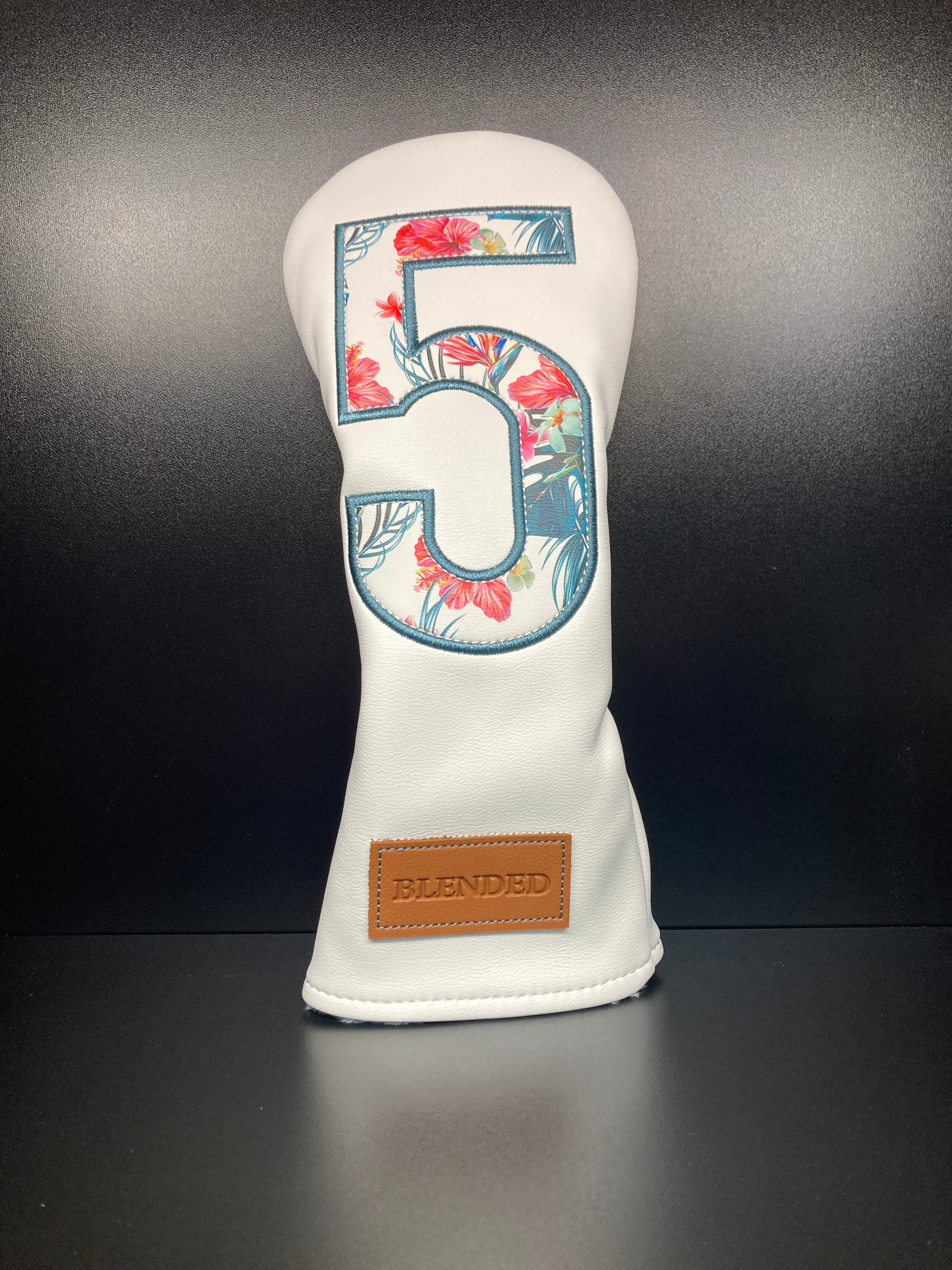 Tropical floral print golf club headcover by ParWestGolf featuring vibrant tropical flower patterns.