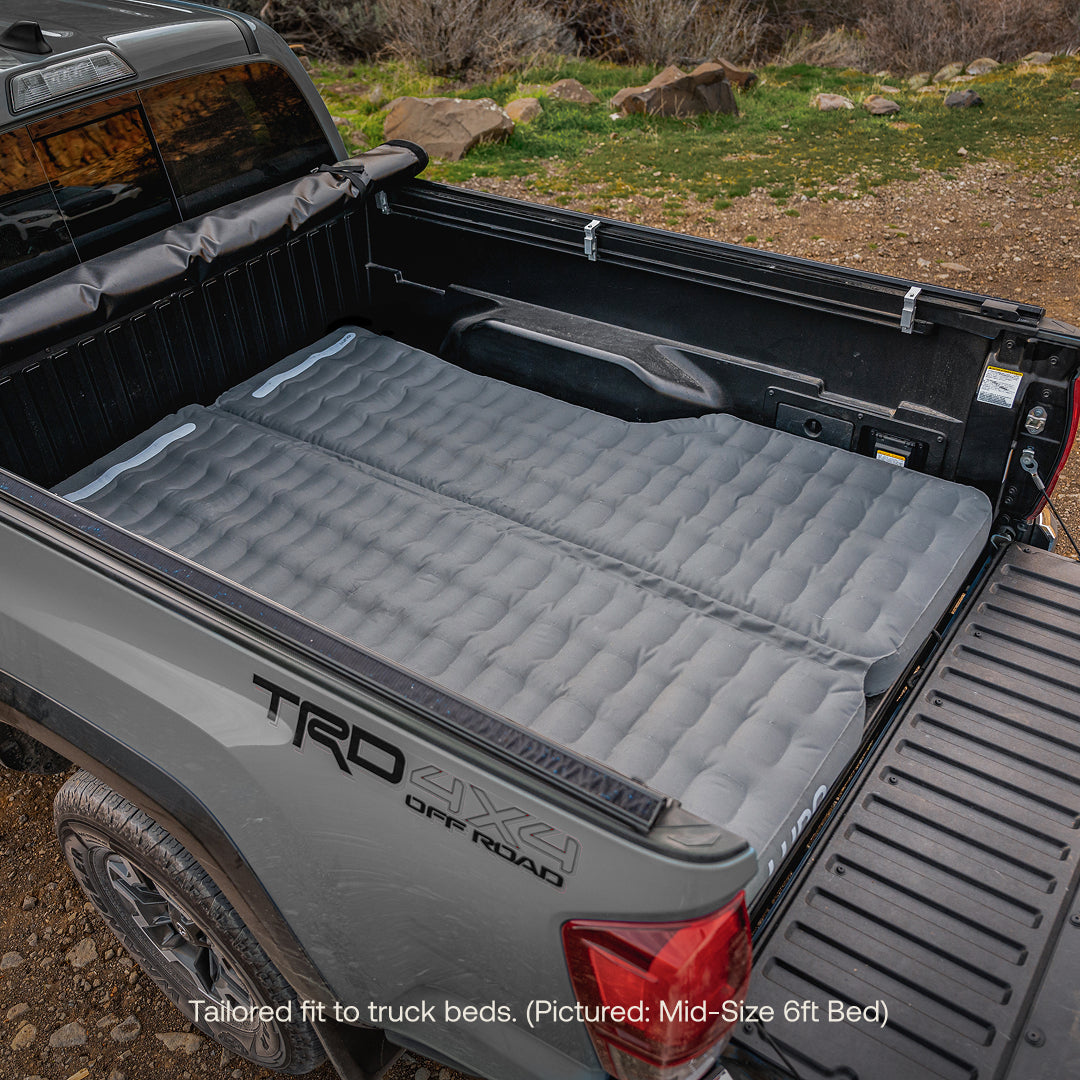 Luno® AIR Truck Bed Mattress in a mid-size truck bed, showcasing its fit and comfort for outdoor adventures.