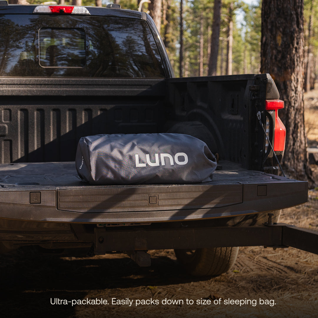 Luno® AIR Truck Bed Mattress designed for 5.5ft truck beds, showcasing a full-size inflatable mattress in a truck.