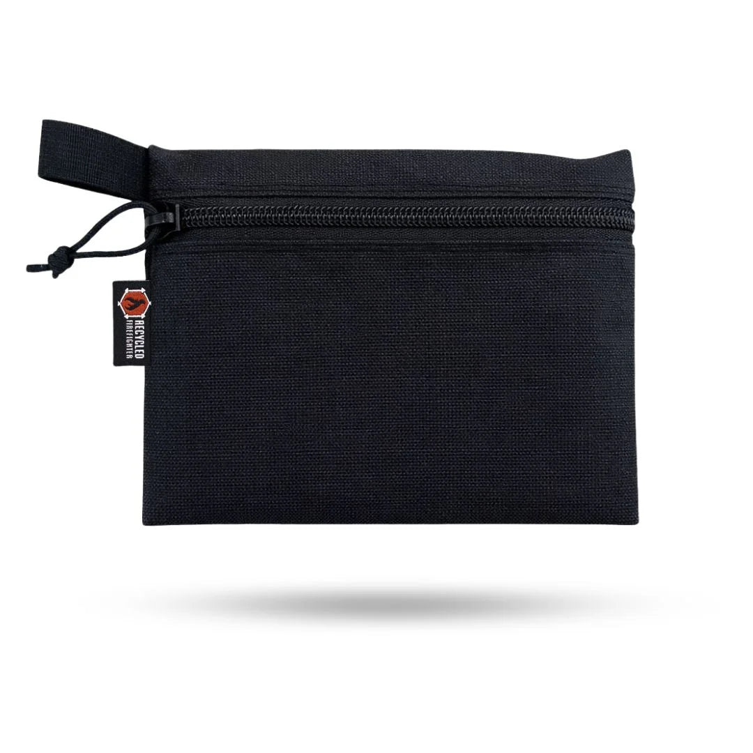 Large Truckie backpack by Recycled Firefighter featuring black and black recycled materials, sturdy design with multiple compartments.