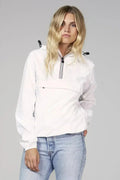 White Femstylo quarter zip packable rain jacket and windbreaker displayed on a hanger, showcasing its lightweight, waterproof design.