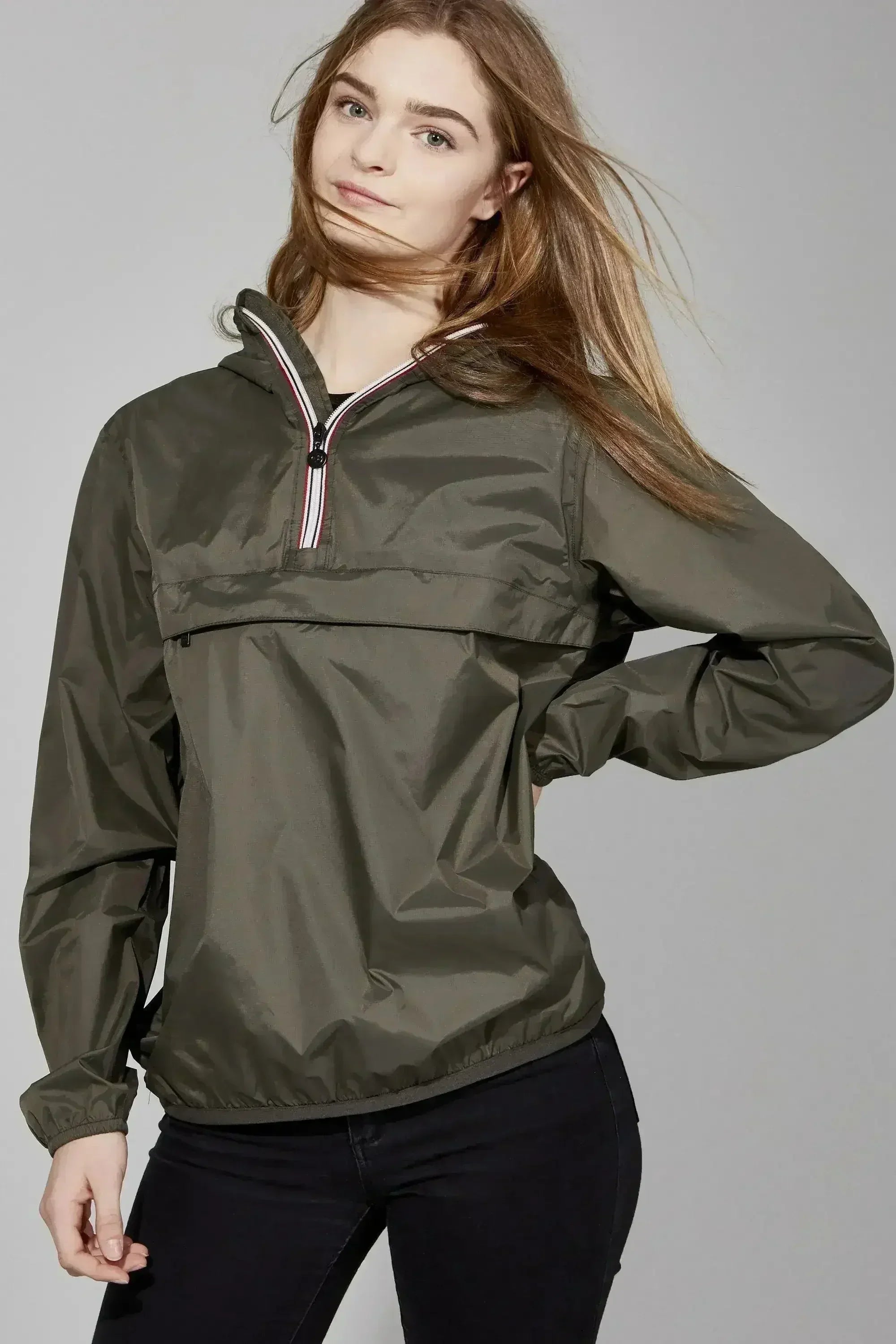 Femstylo Torba quarter zip lightweight packable rain jacket shown on a hanger, in a neutral color, suitable for jackets and coats.