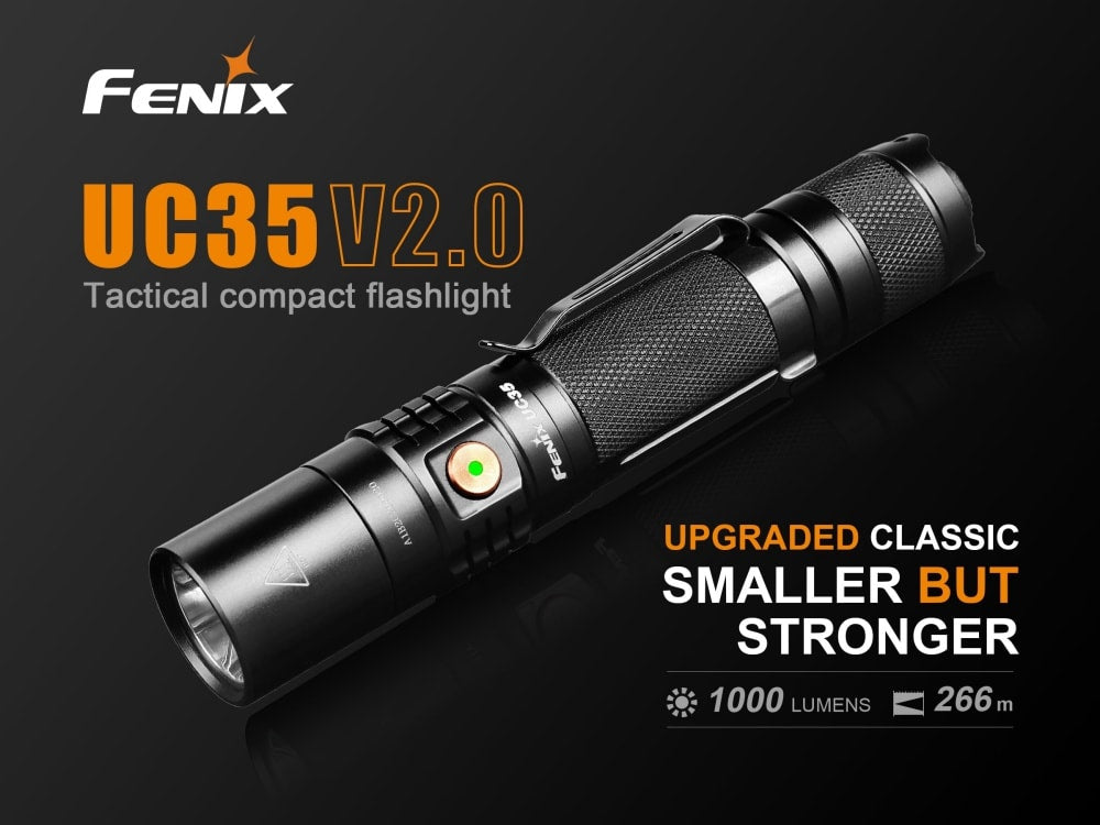 Fenix UC35 V2.0 rechargeable EDC flashlight with compact design and bright LED light, resting on a wooden surface.