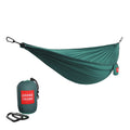 GrandTrunk ultralight starter hammock in green, showcasing its lightweight fabric and compact design in outdoor setting.