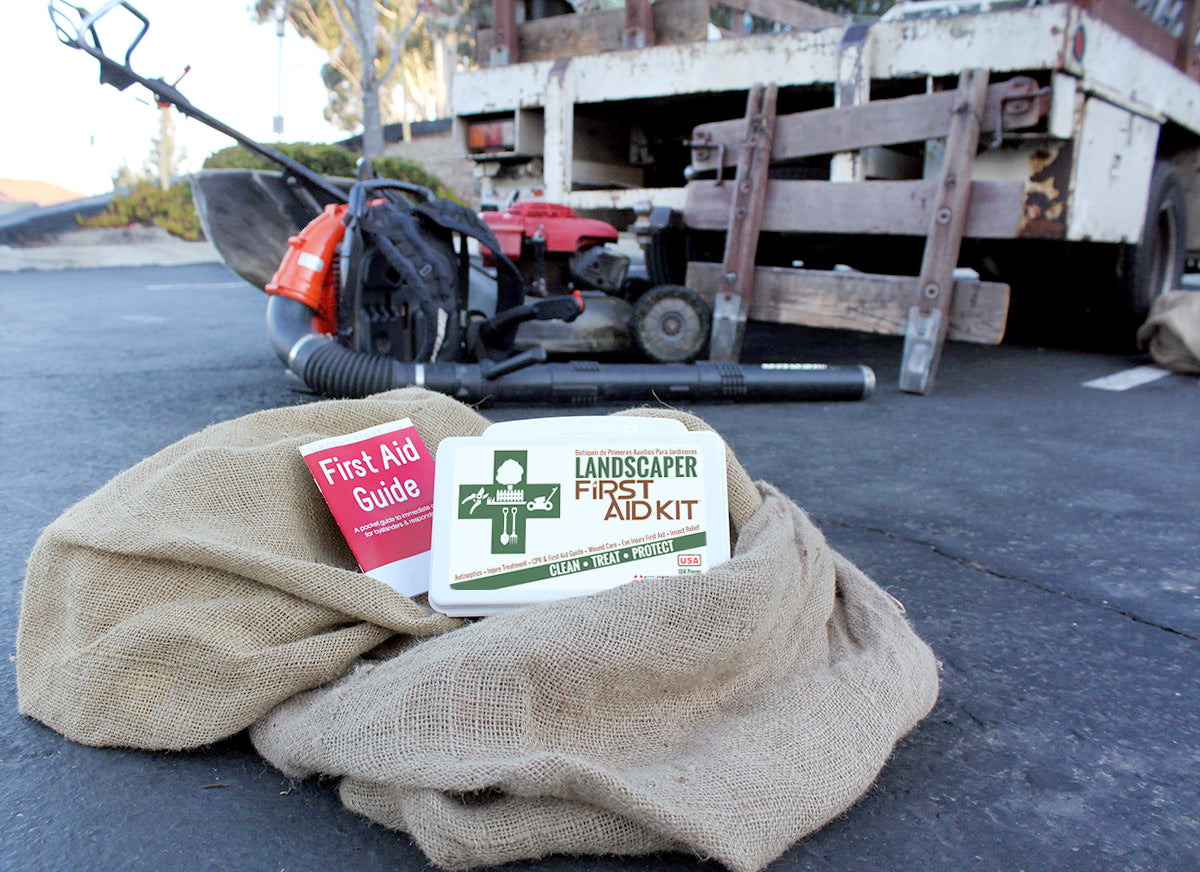 Landscape gardener's first aid kit with 103 pieces in a plastic case, including bandages, antiseptic wipes, and first aid supplies.