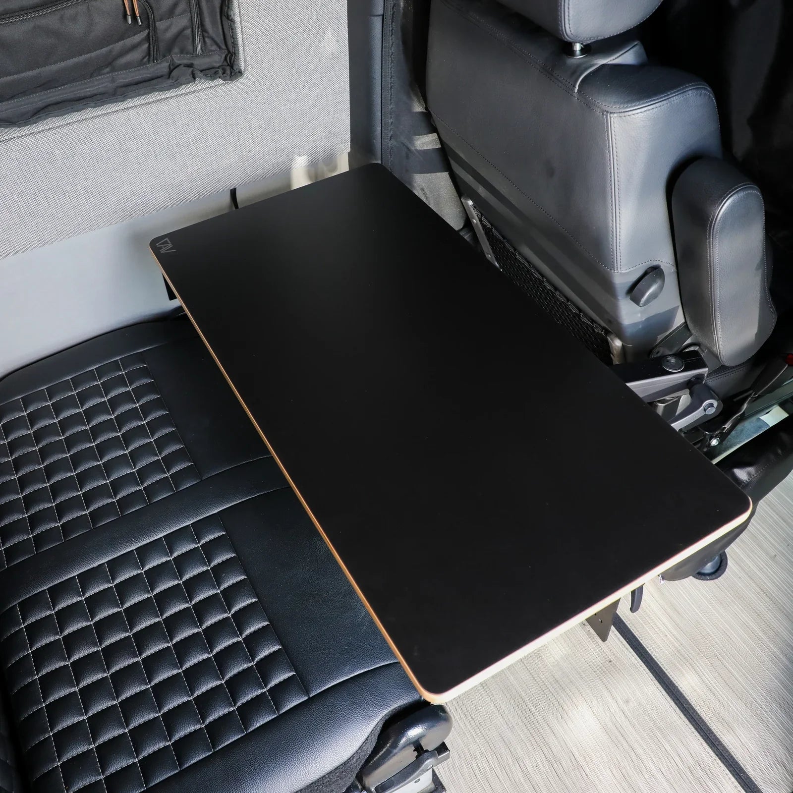 Large universal table top by Canyon Adventure Vans, showcasing a sleek carbon finish and sturdy design for versatile use.