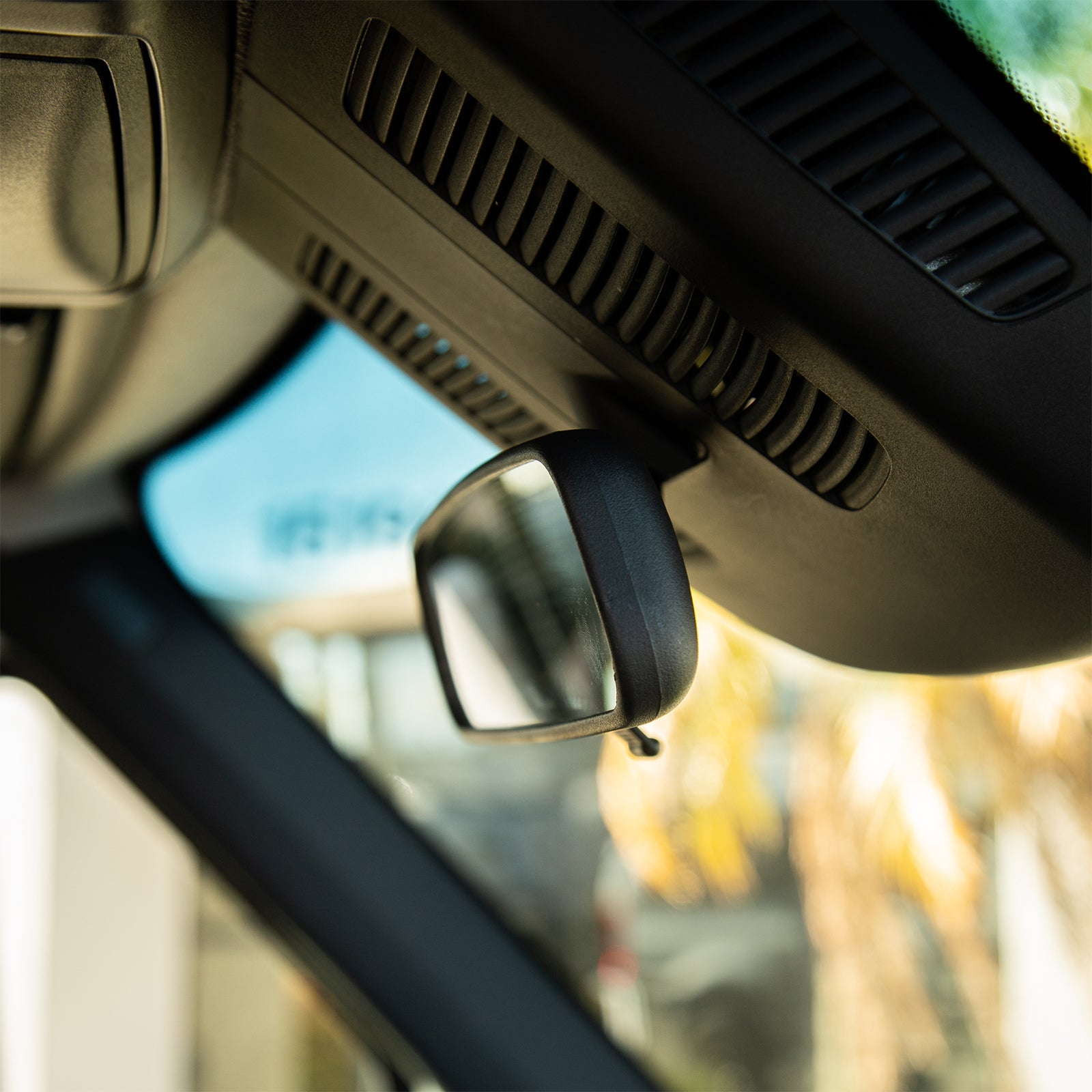 The Van Mart Sprinter rear view mirror showcasing its sleek design and reflective surface for optimal visibility.