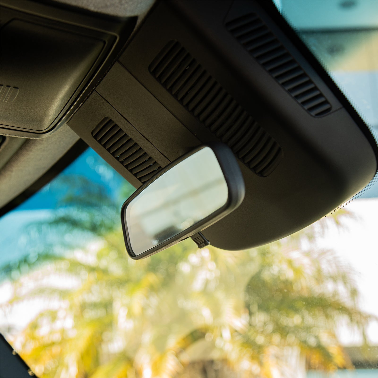The Van Mart Sprinter rear view mirror showing sleek design and clear reflective surface for enhanced visibility.