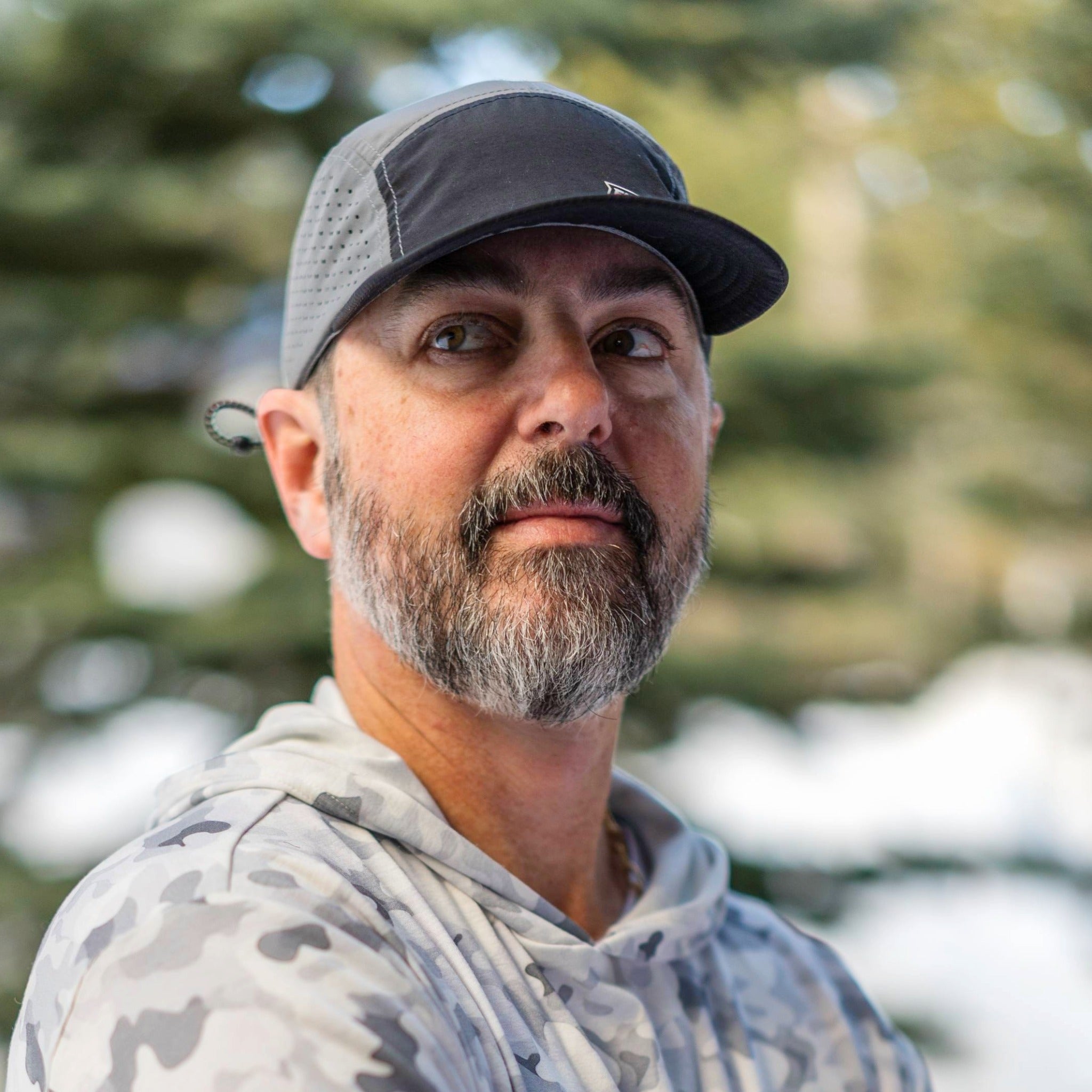Black and grey crushable 5-panel camper hat by Faultline395, shown with a flexible brim and casual design.