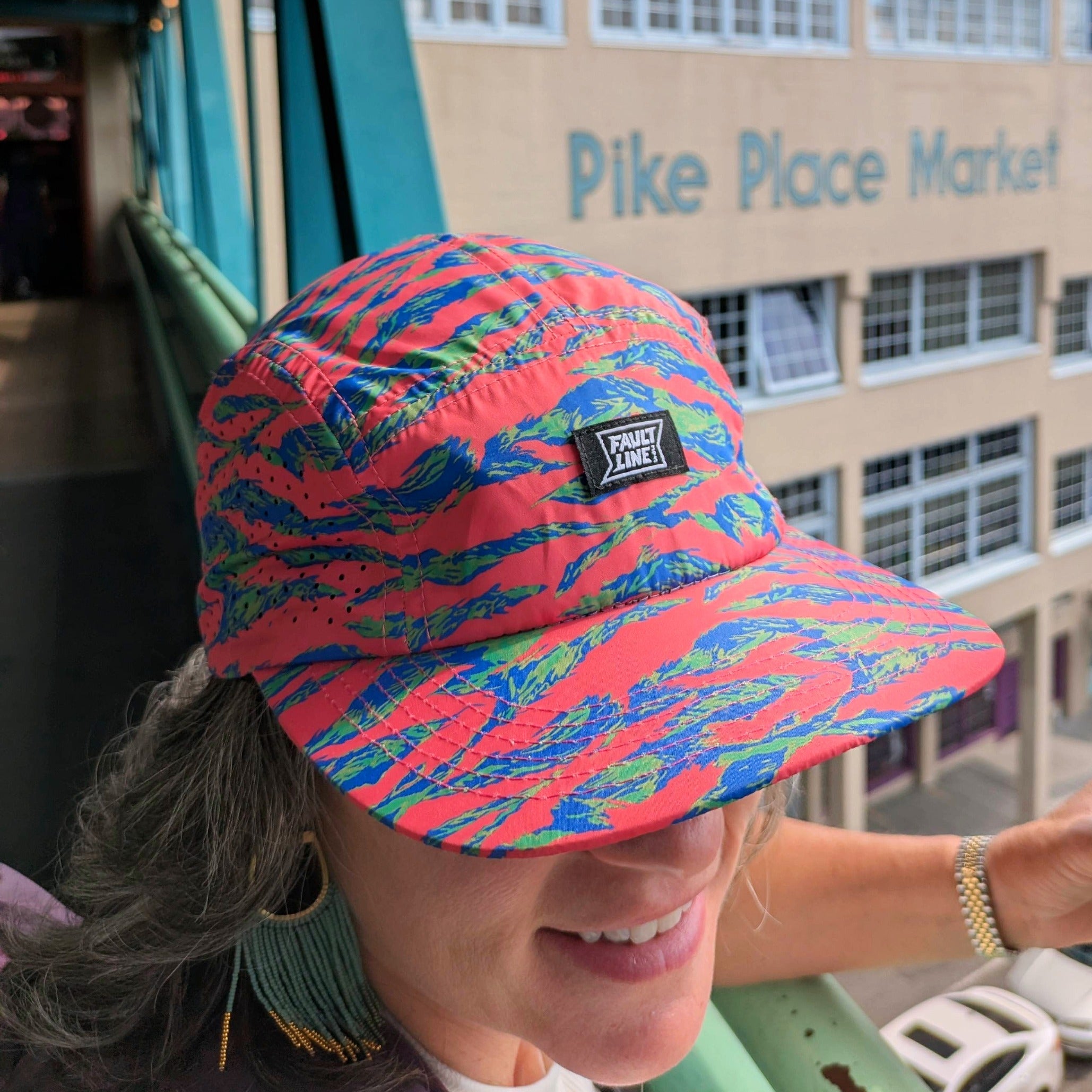 Faultline395 Bridgeport 5-Panel Camper Hat in pink tiger camo with adjustable strap and curved brim.