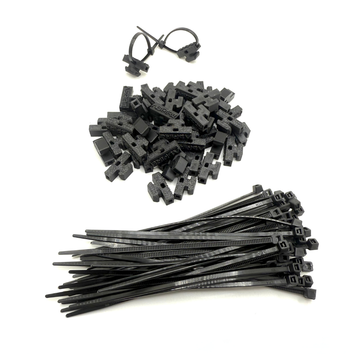 Aspire Auto Accessories wire management zip-tie holders for roof racks, shown attached to a vehicle roof rack for organized wiring.