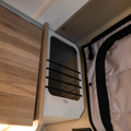 Ekko Cab Cubby by Canyon Adventure Vans, made in Utah, featuring a wooden storage cubby with natural finish and sturdy design.