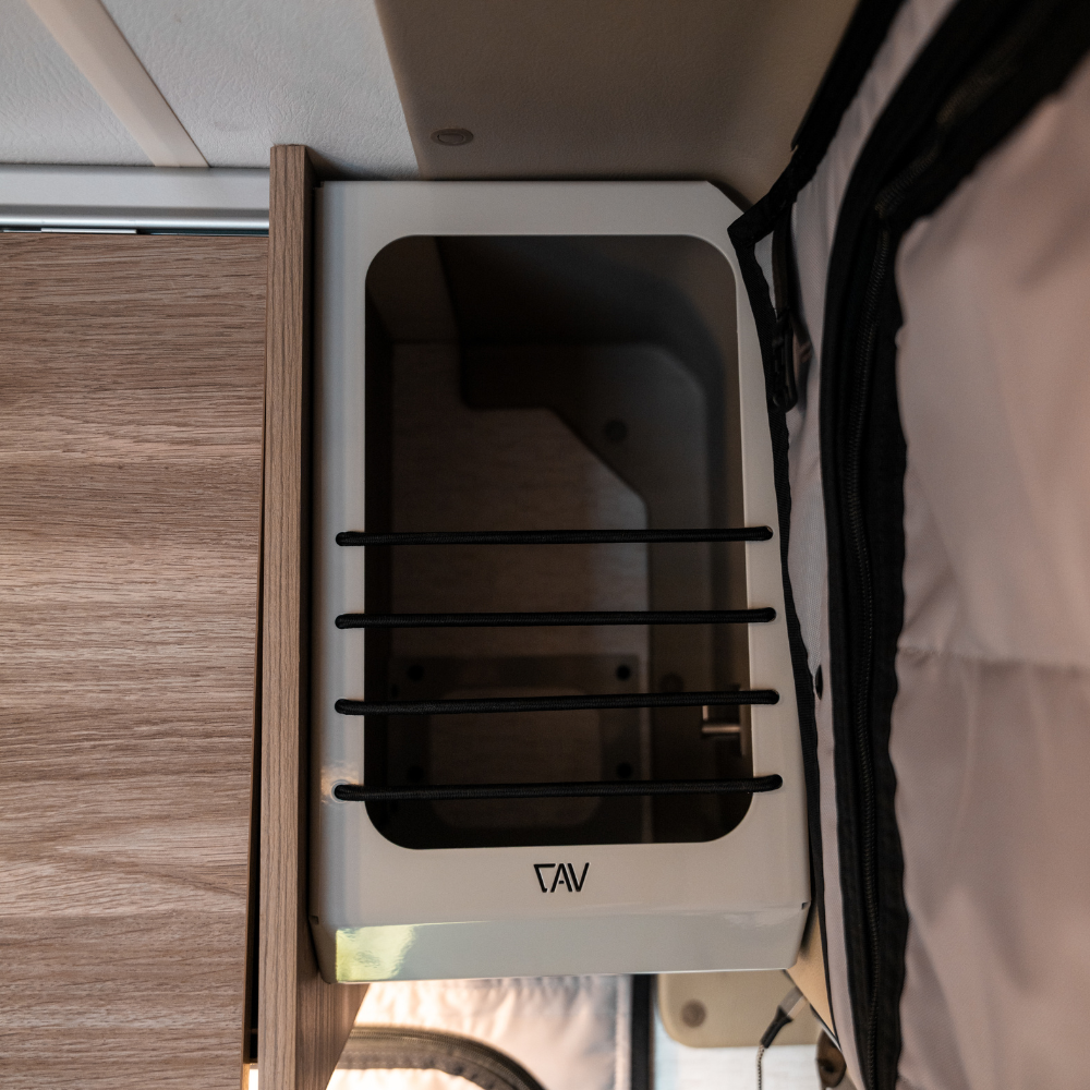 Ekko Cab Cubby by Canyon Adventure Vans, made in Utah, featuring a wooden cubby storage unit with natural finish and rustic design.