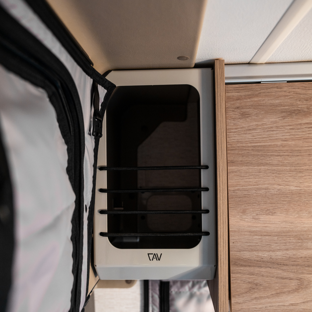 Canyon Adventure Vans Ekko Cab Cubby made in Utah, showcasing a wooden storage cubby with natural finish and rustic design.