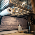 Ekko Under Cabinet Shelf by Canyon Adventure Vans for kitchen storage, made in Utah, shown mounted under kitchen cabinets.