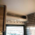 Ekko Doorway Upper Cabinet by Canyon Adventure Vans, made in Utah, featuring durable construction and spacious storage for van interiors.