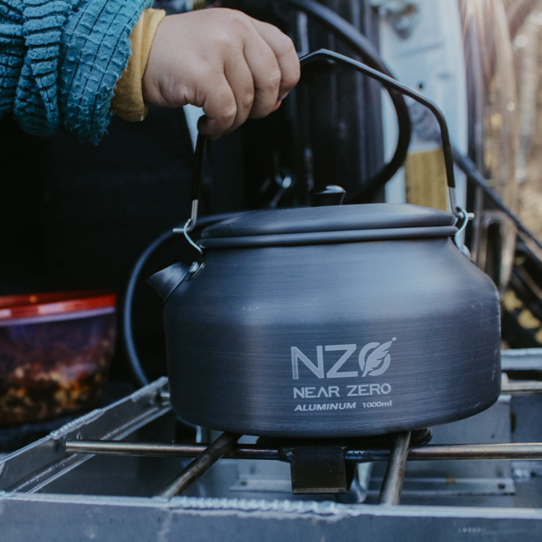 Near Zero Outdoor Gear 1.0L aluminum kettle with handle and spout, suitable for camping and outdoor cooking.