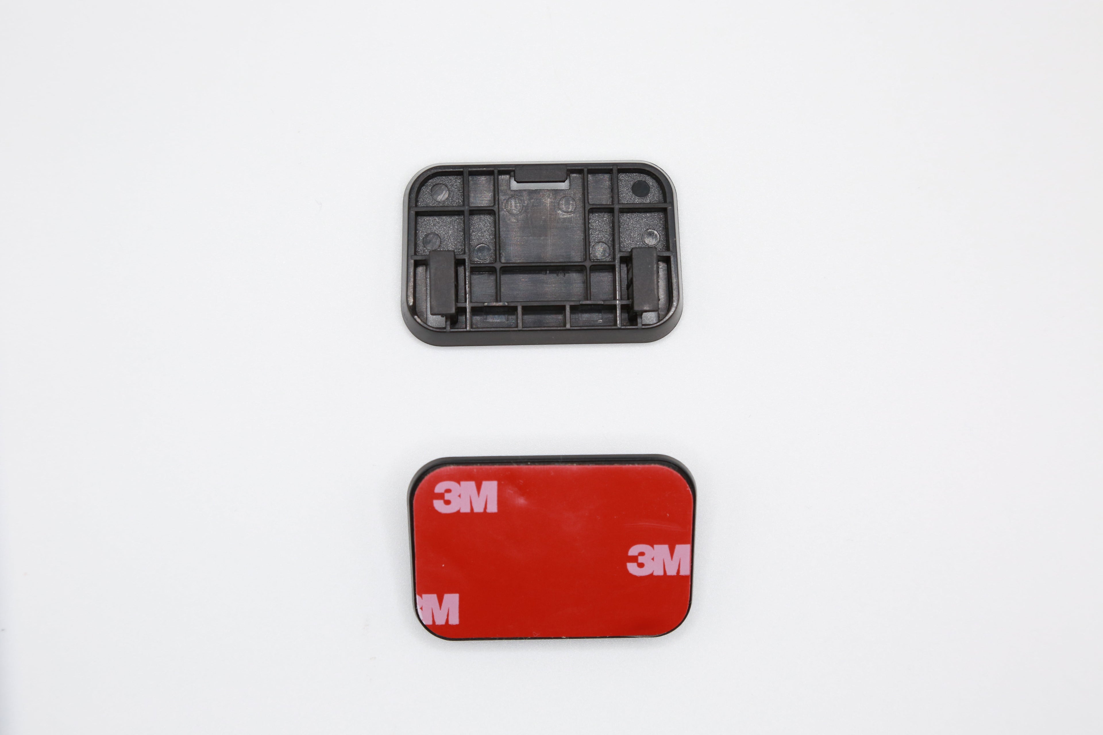 Rexing V2 Pro AI adhesive mount for dash camera, showing sturdy mounting bracket with adhesive pad attachment