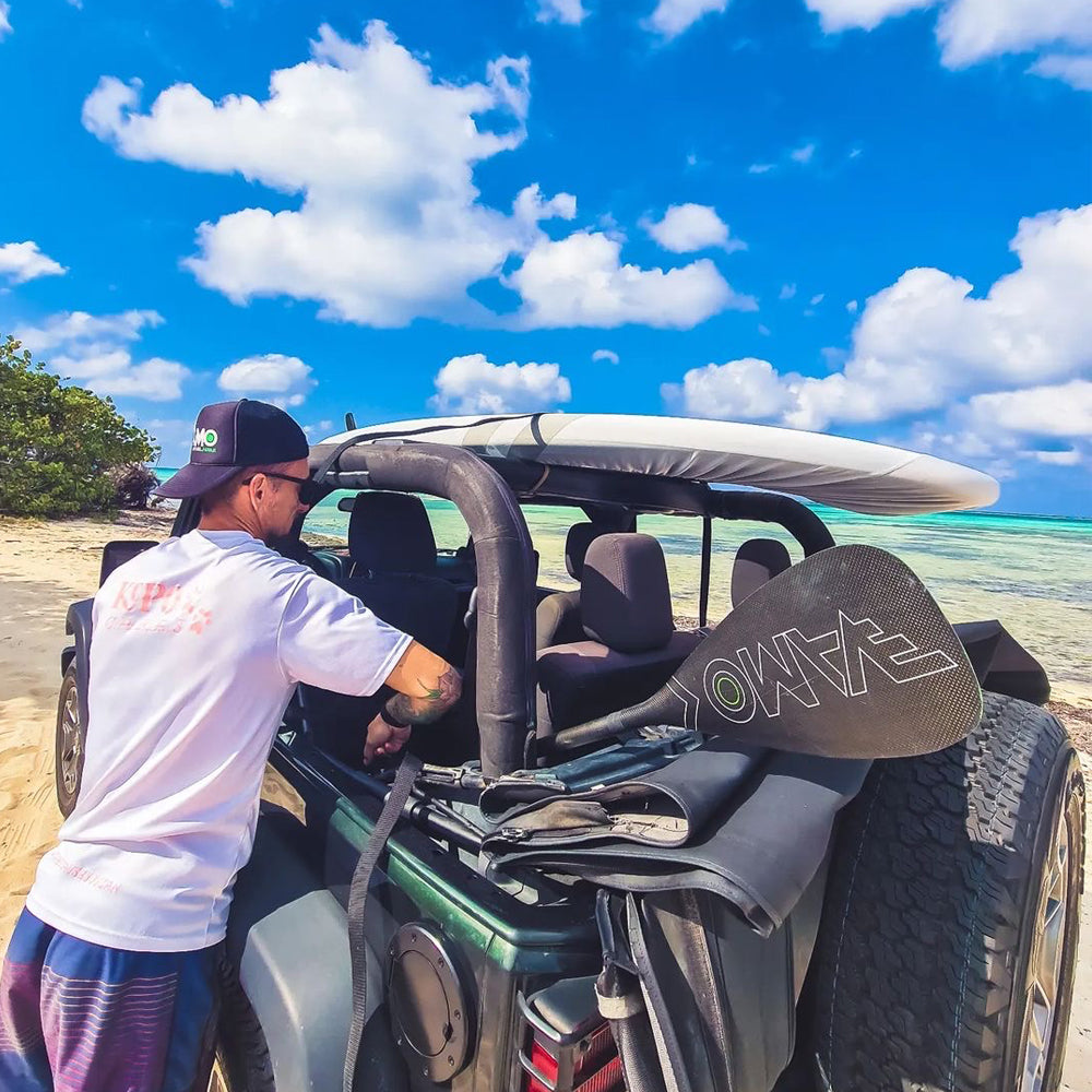 Full carbon adjustable SUP paddle with ABS edge by Vamo Life, featuring a sleek black SR71 design and lightweight construction.
