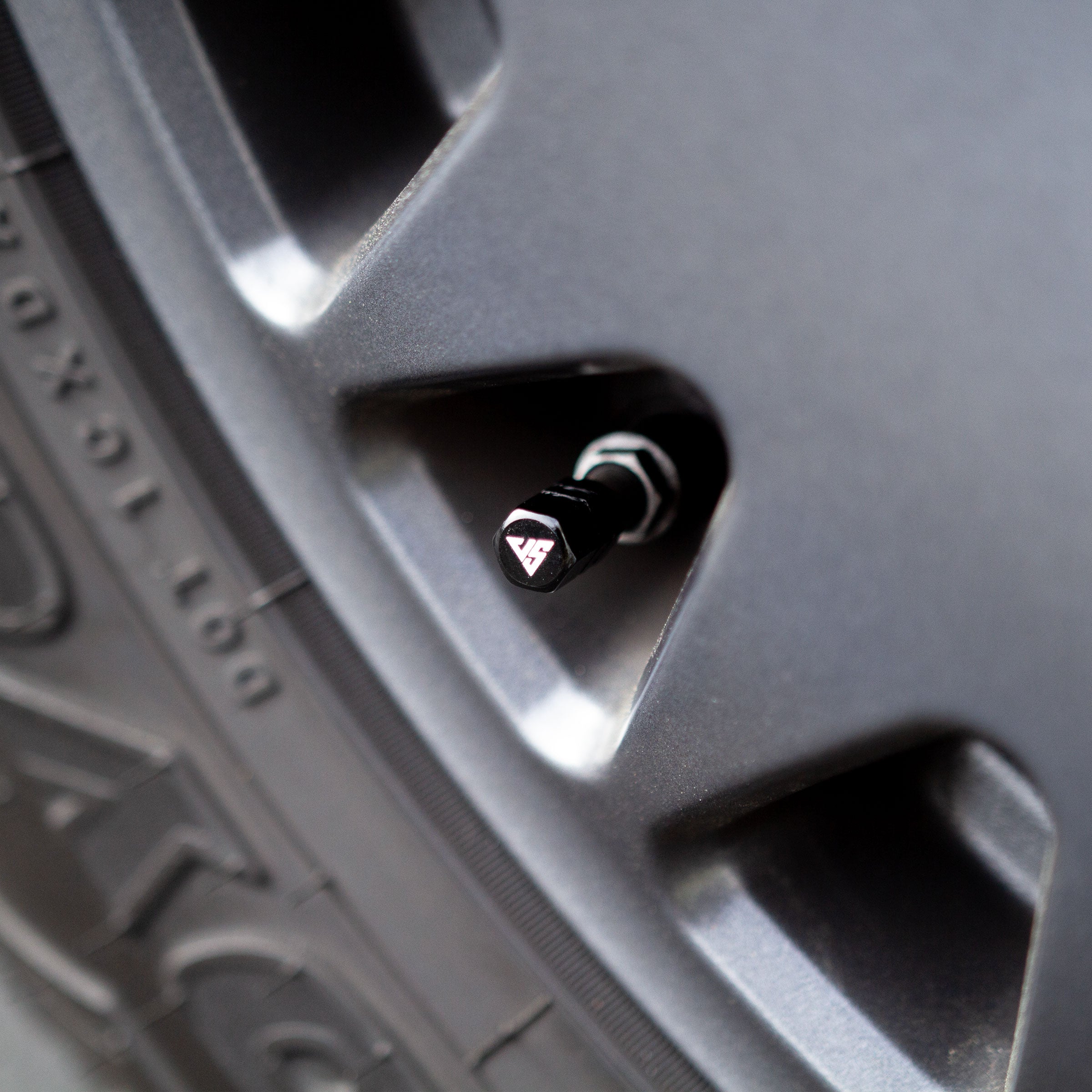 Universal valve stem caps by The Van Mart in various colors displayed on a white background.