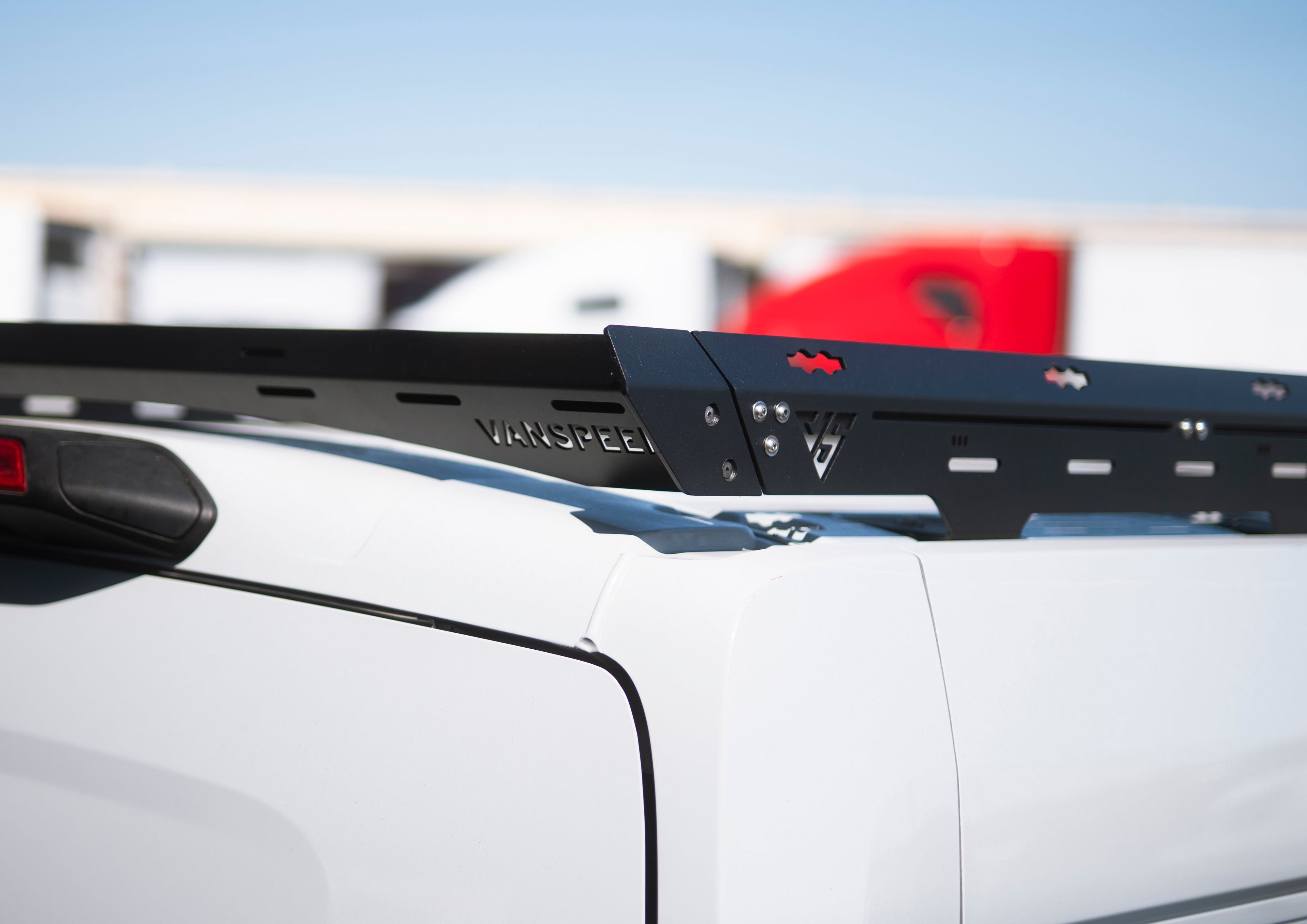 The Van Mart Transit Scout Rack 148 mounted on a vehicle, showcasing its sturdy design and multiple attachment points.
