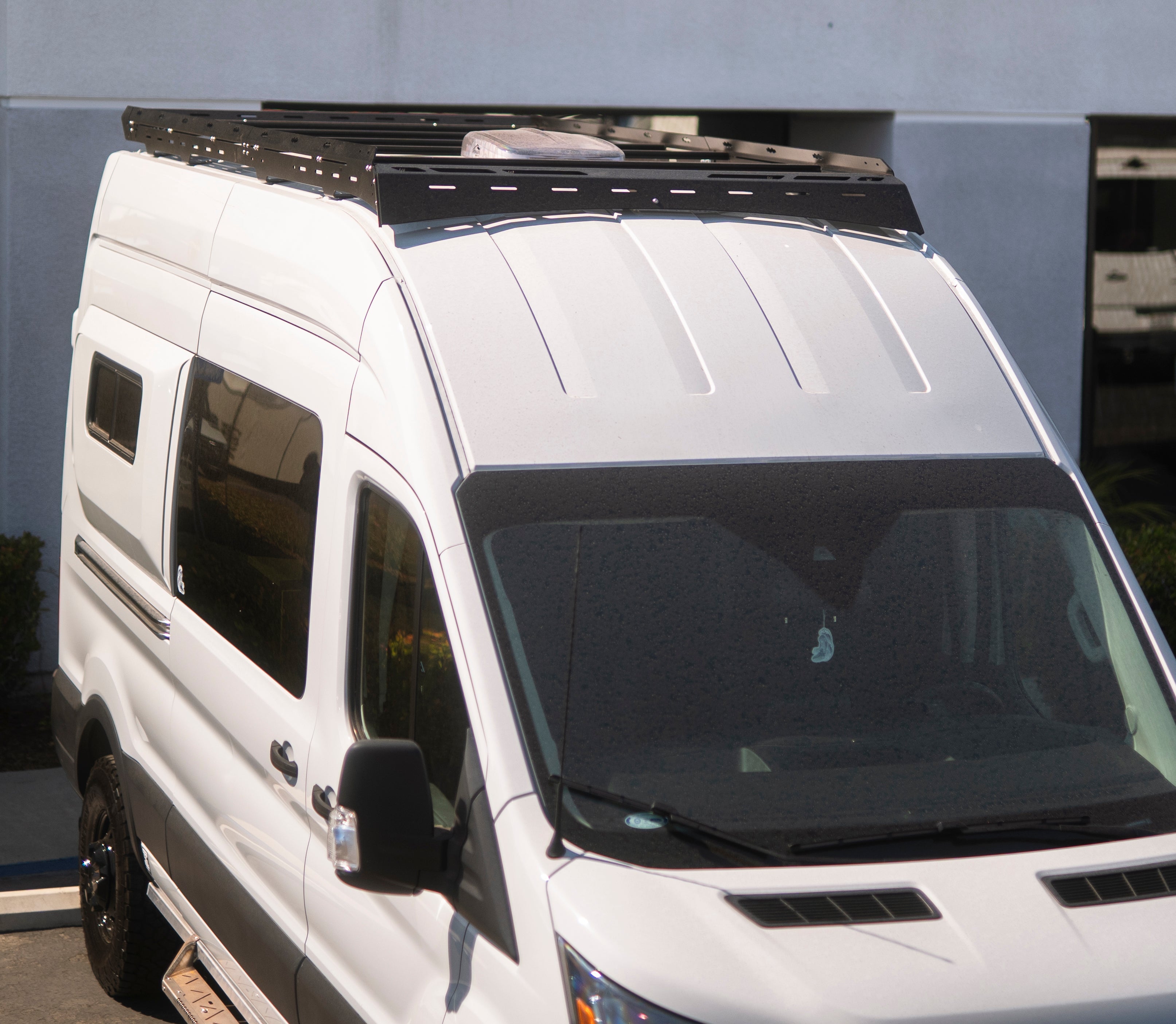 Transit Scout Rack 148 by The Van Mart mounted on a vehicle, showcasing its sturdy design and functional features.