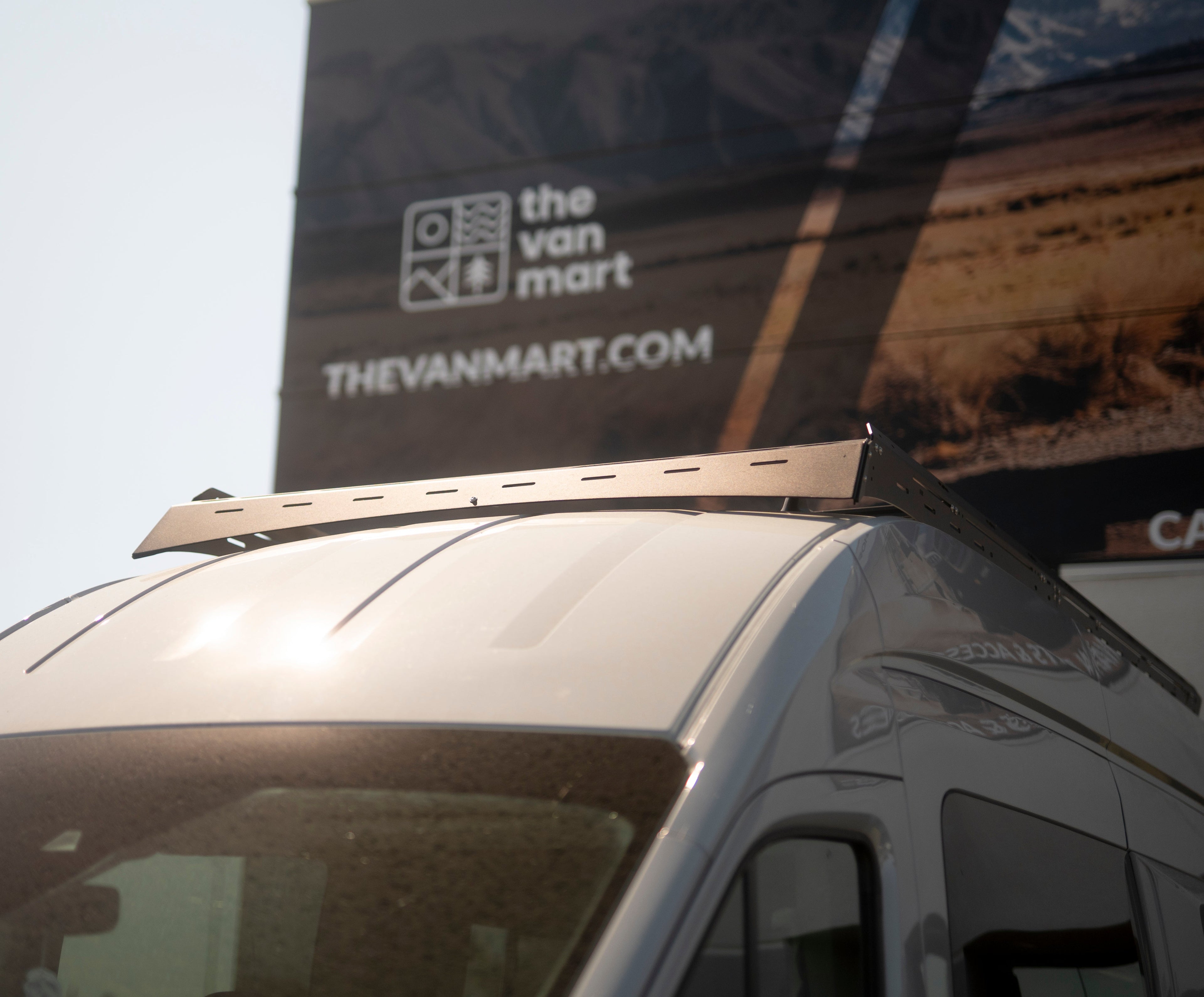 The Van Mart Transit Scout Rack 148 mounted on a vehicle, showcasing its sturdy design and adjustable features.