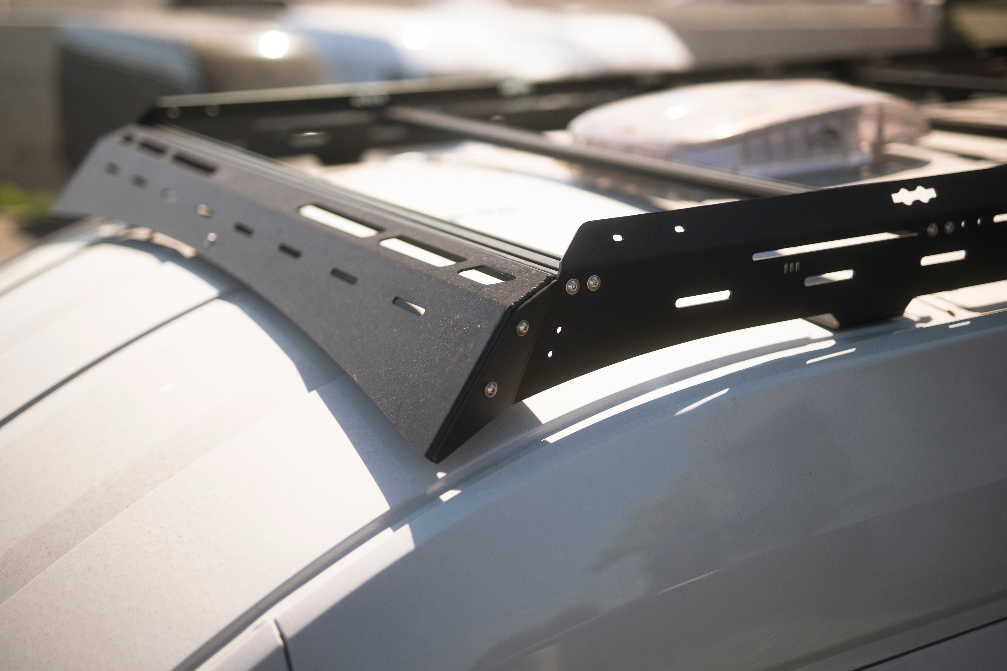 The Van Mart Transit Scout Rack 148 mounted on a vehicle, showcasing its sturdy frame and adjustable features.