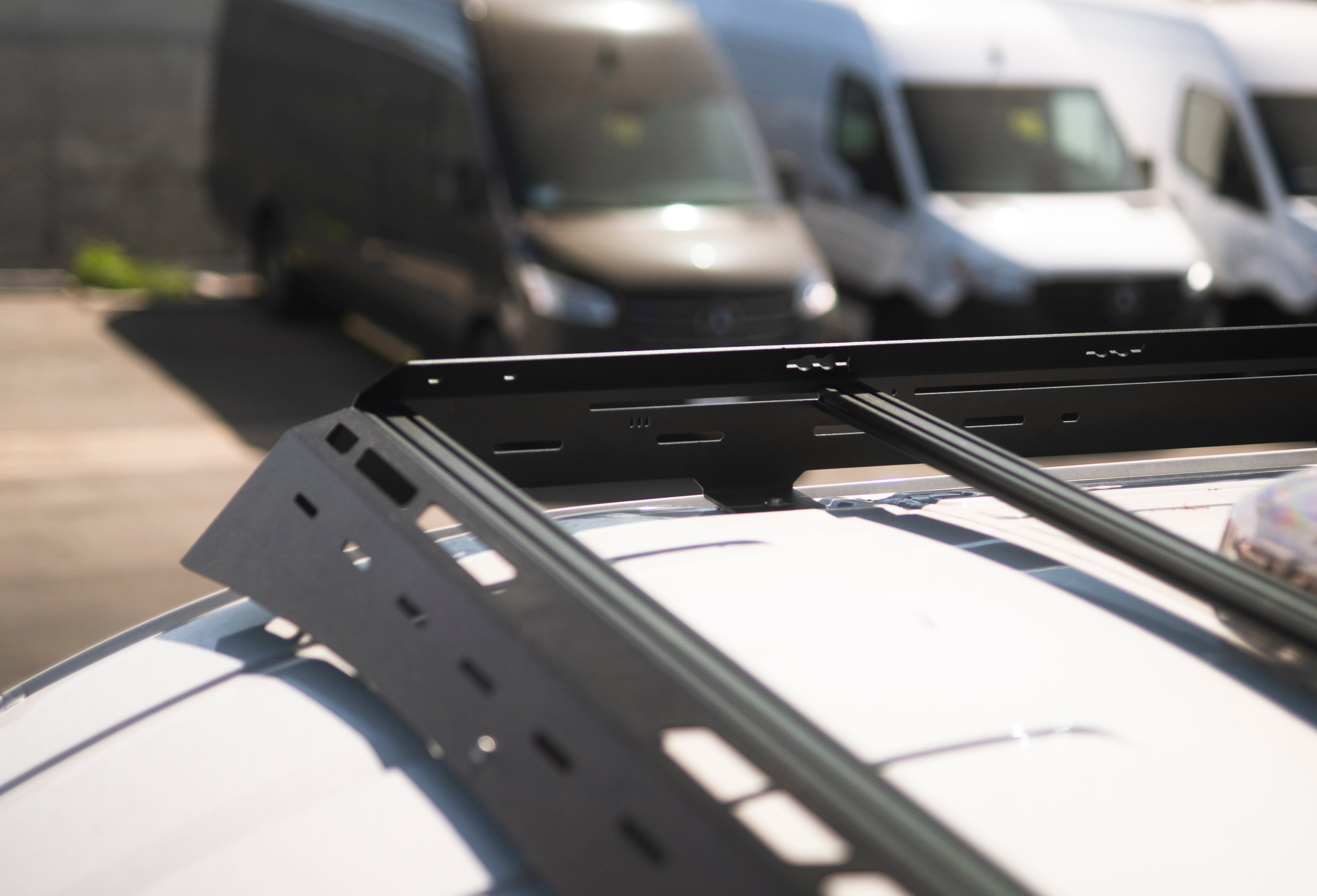 The Van Mart Transit Scout Rack 148 mounted on a vehicle, showcasing its sturdy design and adjustable features.