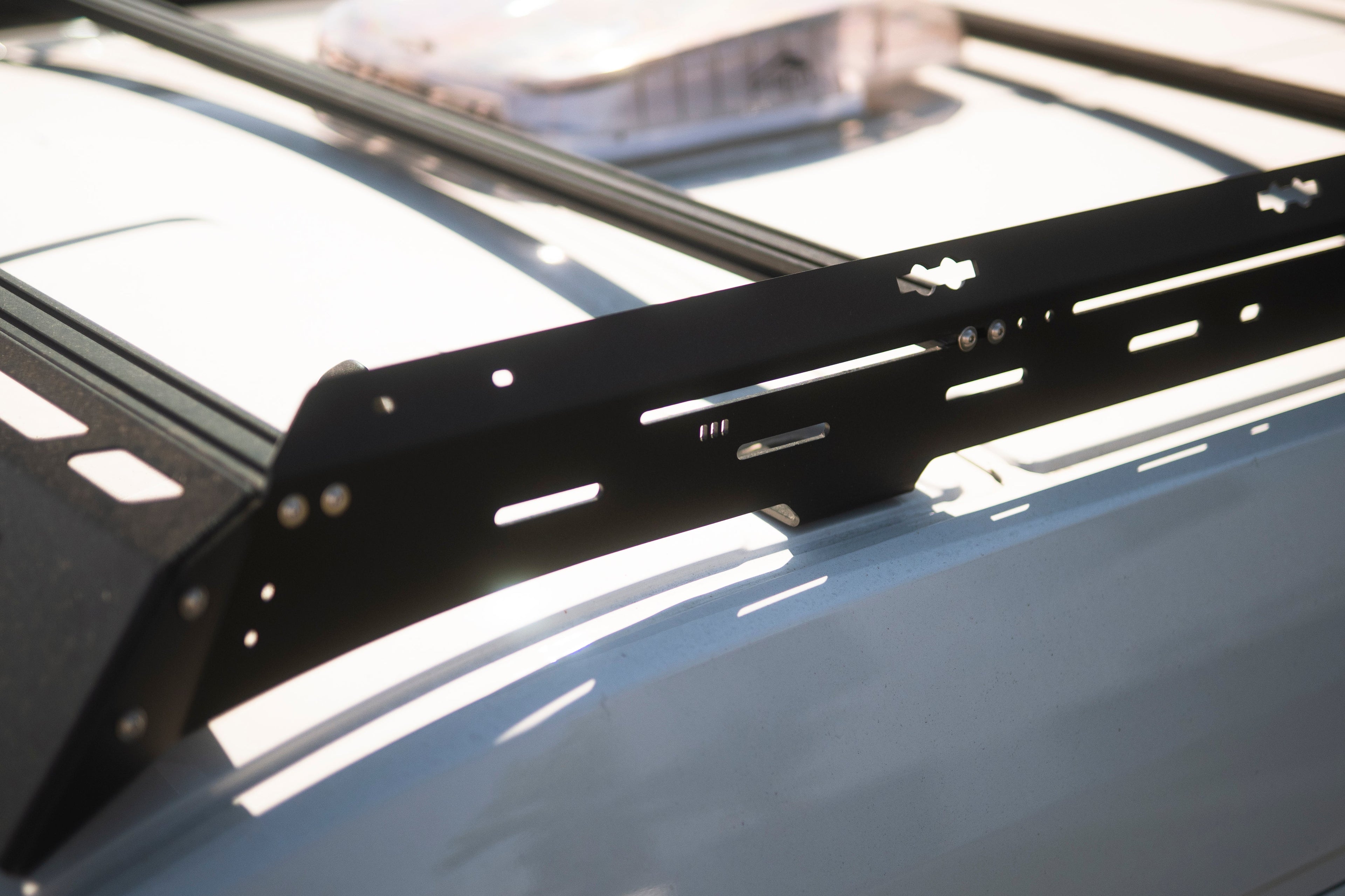 The Van Mart Transit Scout Rack 148 mounted on a vehicle, showcasing its sturdy design and adjustable features.