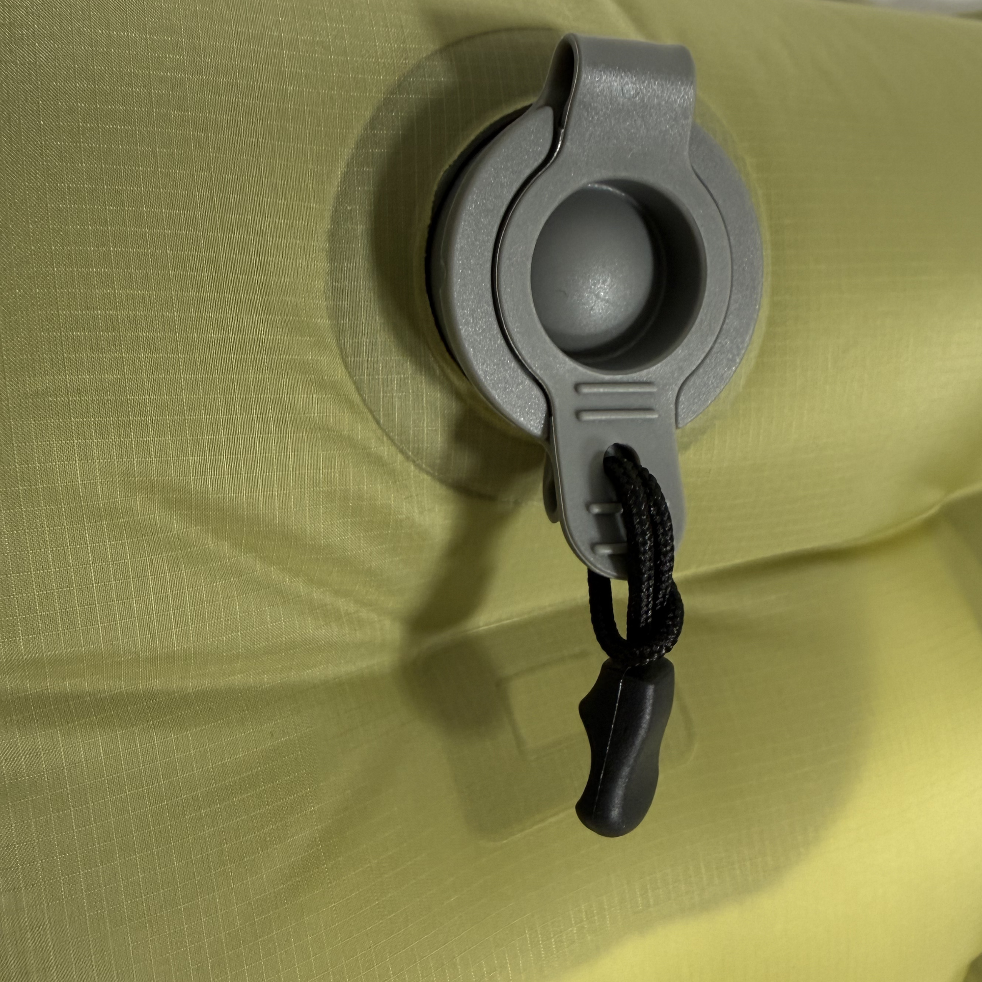 Near Zero Outdoor Gear insulated inflatable sleeping pad with valve, designed for camping comfort and portability.