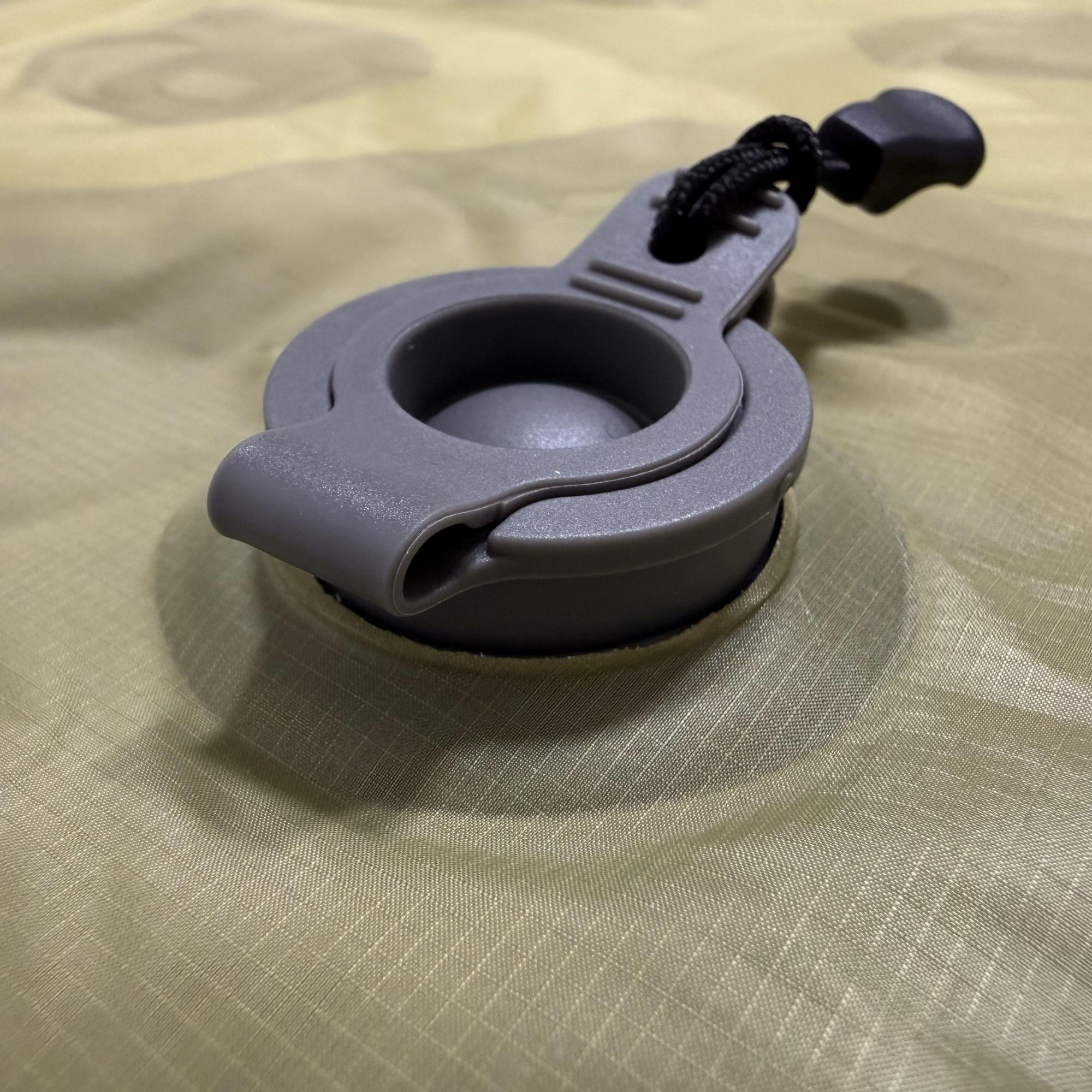 Close-up of the valve on the Near Zero Outdoor Gear insulated inflatable sleeping pad showing the valve detail.