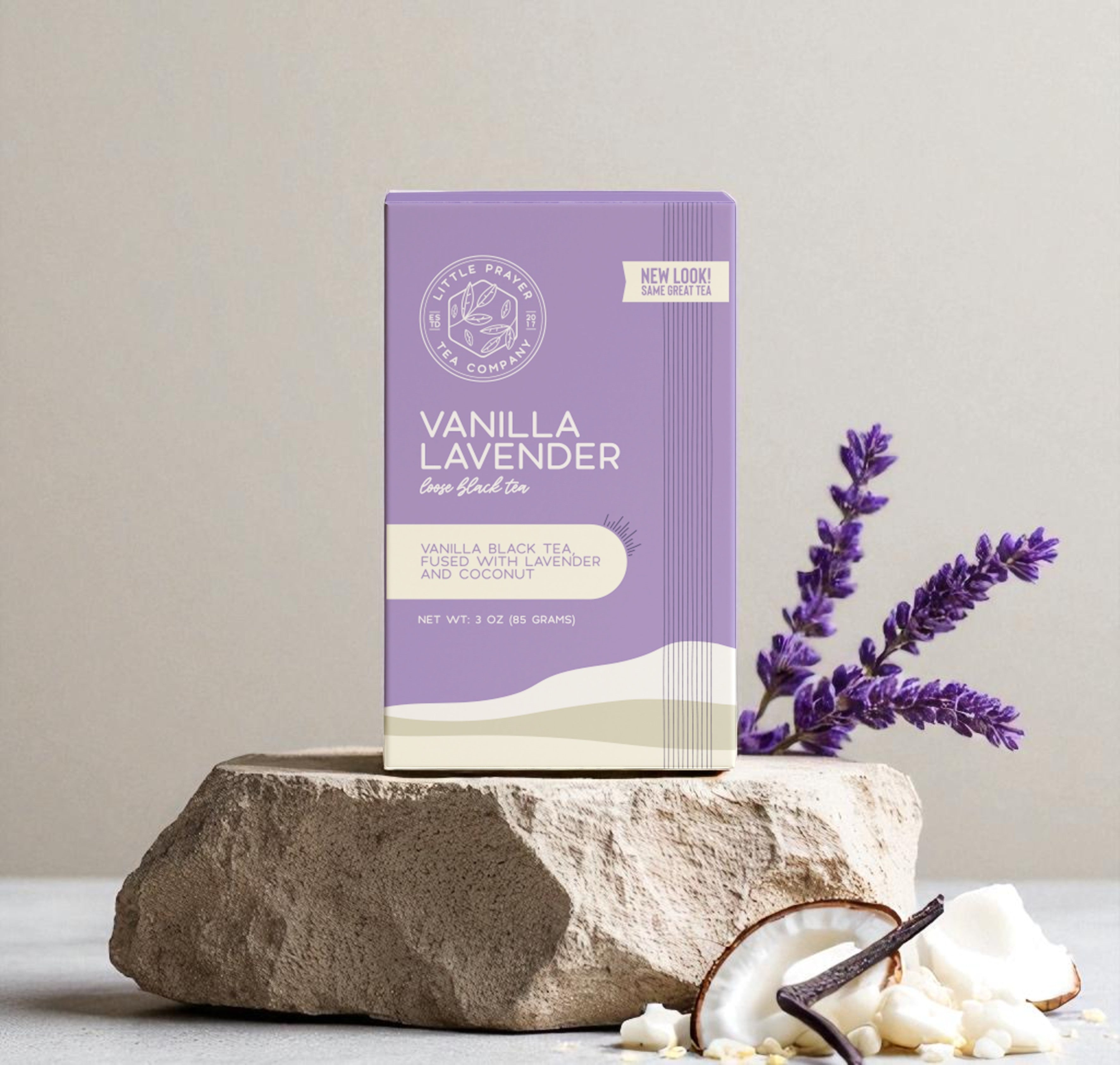Black vanilla lavender tea by Little Prayer Tea Company in a cozy tea setting with a tea cup and loose tea leaves.