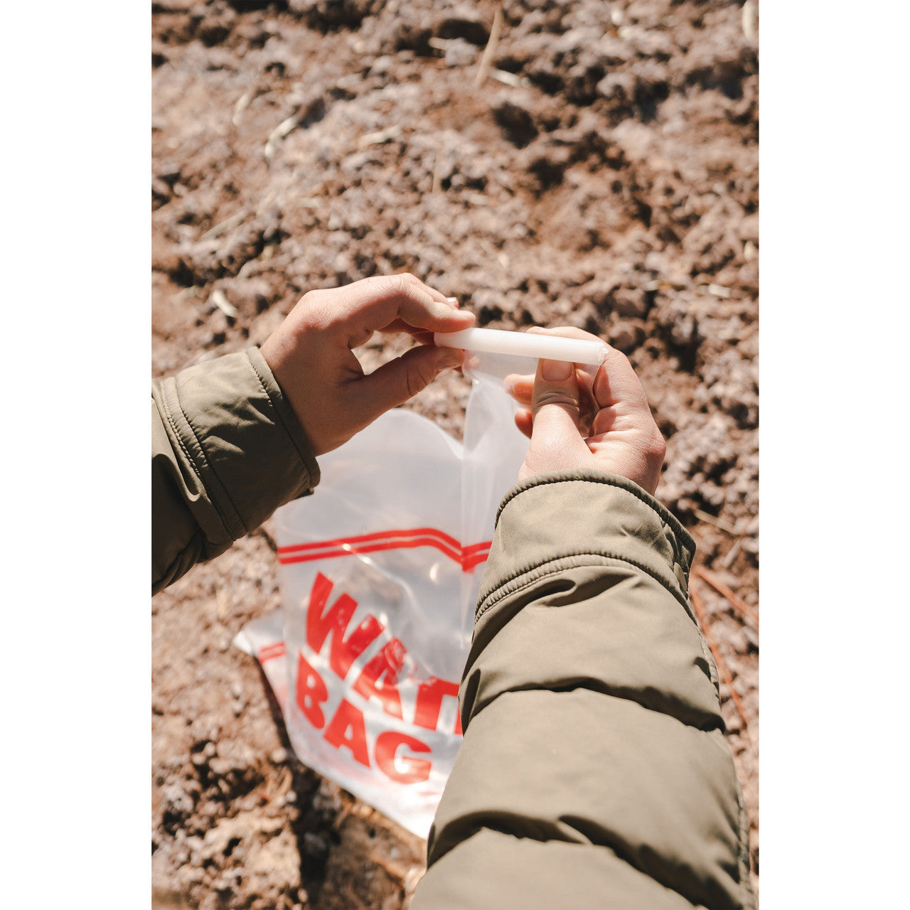 Flat fold 2-gallon water carrier from QuakeKits, portable emergency water storage jug with flexible, foldable design for food and water use.