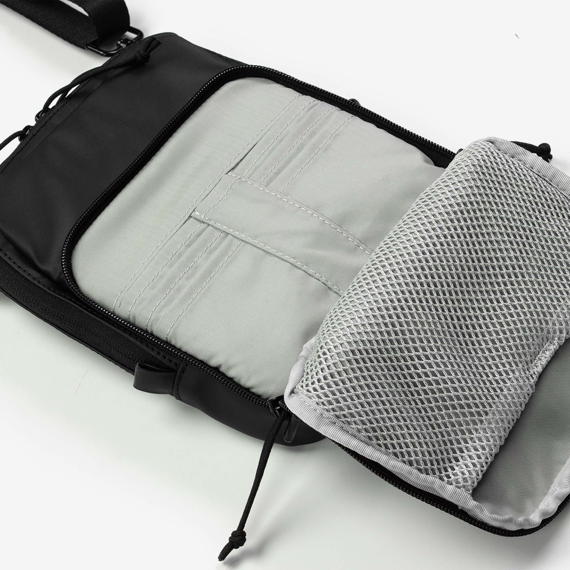 Elite Survival Systems Microguard Mini Crossbody Concealment Pouch with wallet shown, designed for discreet carry and secure storage.