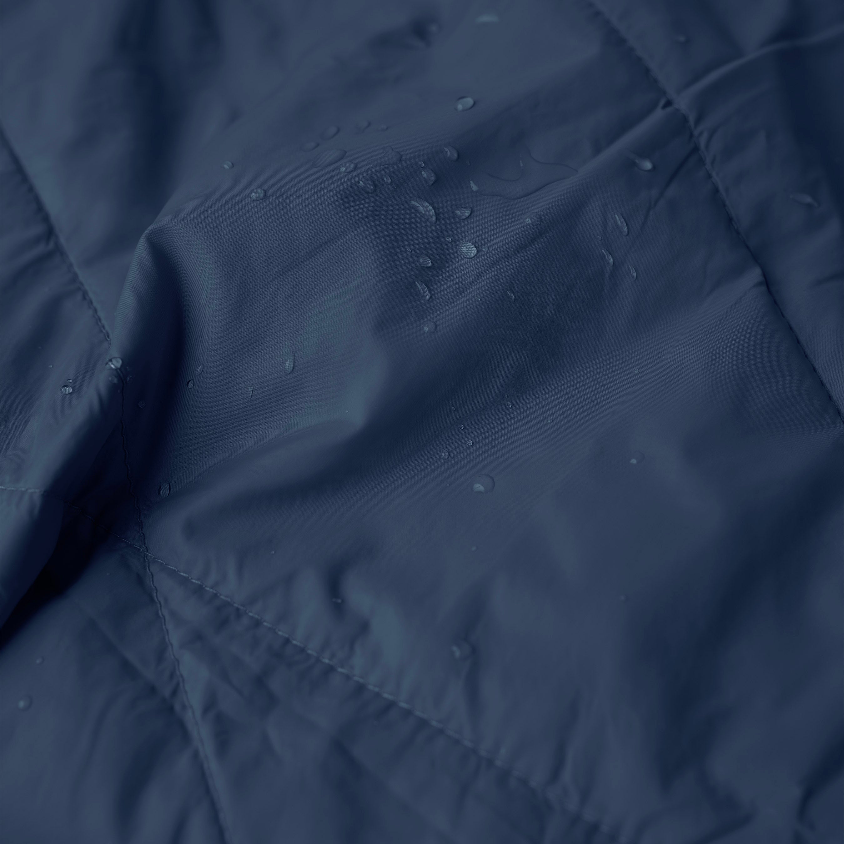 Gravel Layover™ XL Blue Travel Blanket spread out, showing soft fabric and cozy texture, ideal for travel and comfort.