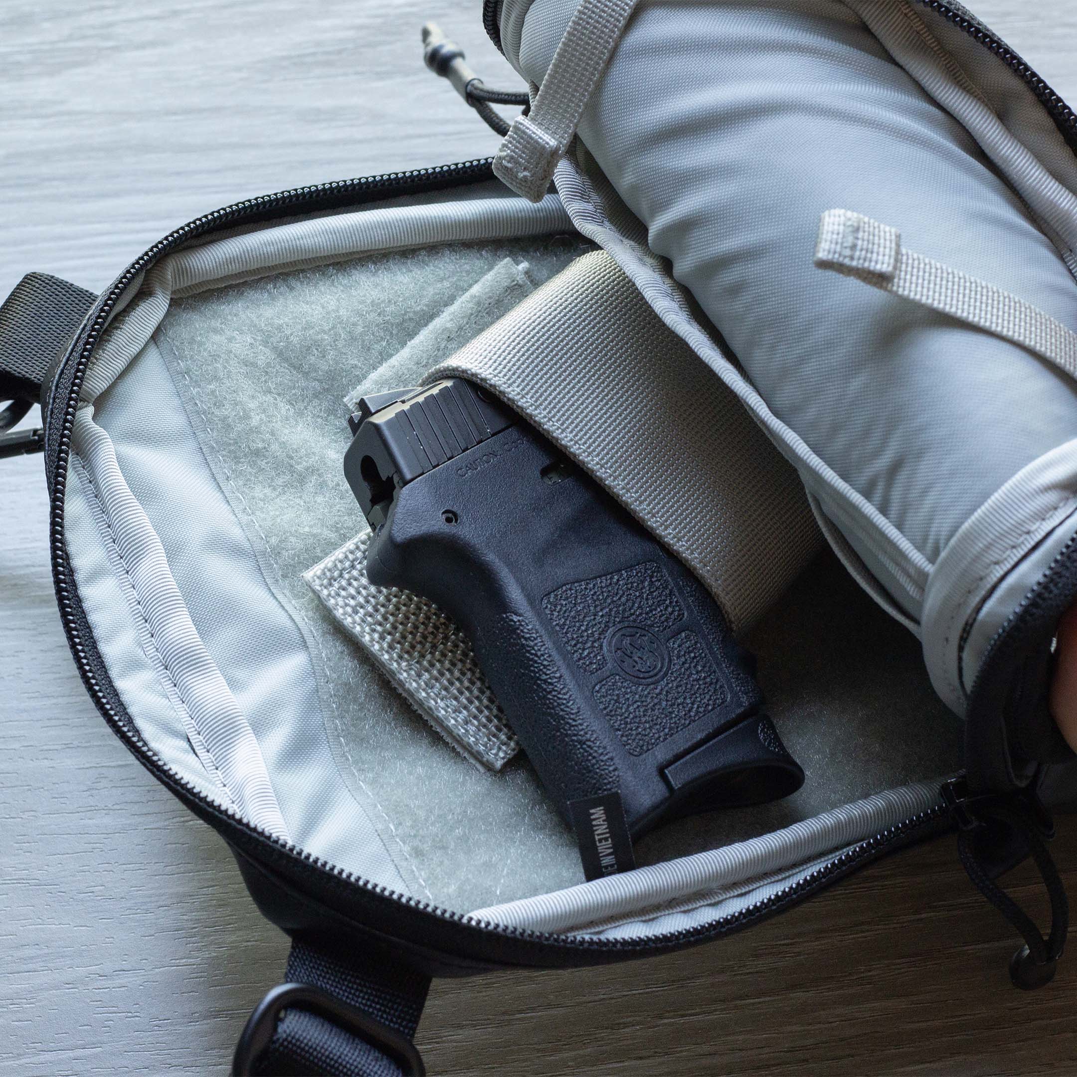 Elite Survival Systems Microguard Mini Crossbody Concealed Carry Bag with weapon concealment pouch and adjustable strap.