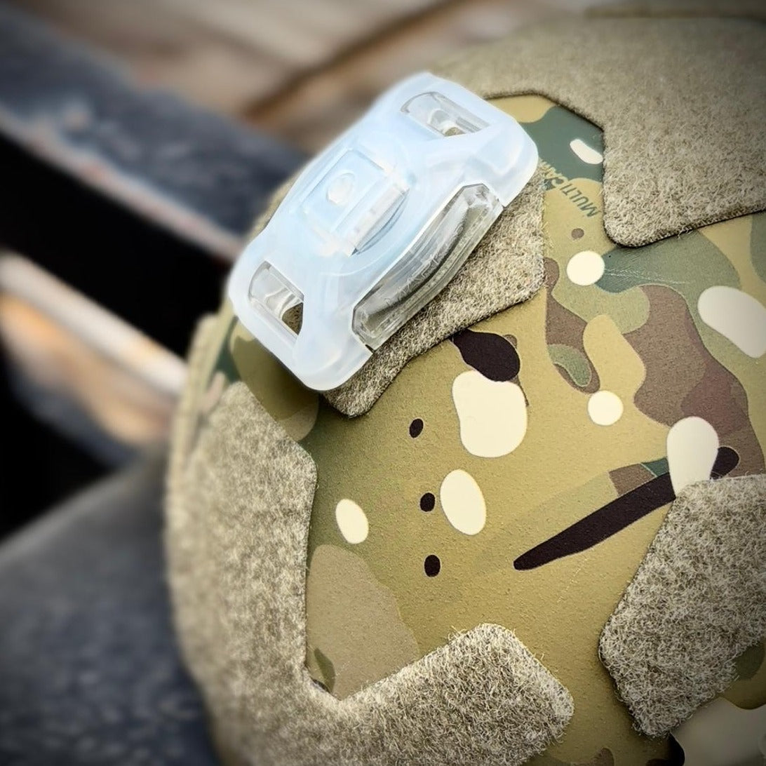 HCC Tactical Mark SB Beacon for illumination and marking, showcasing a compact, bright design in a dark setting.