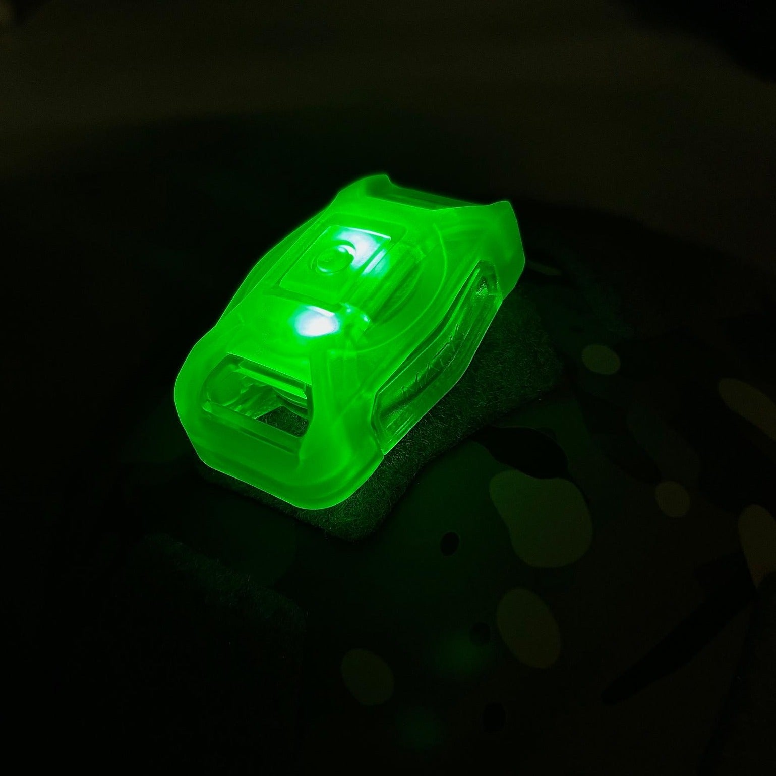 HCC Tactical Mark SB Beacon in use, illuminating the area with bright, vibrant light for marking and visibility.