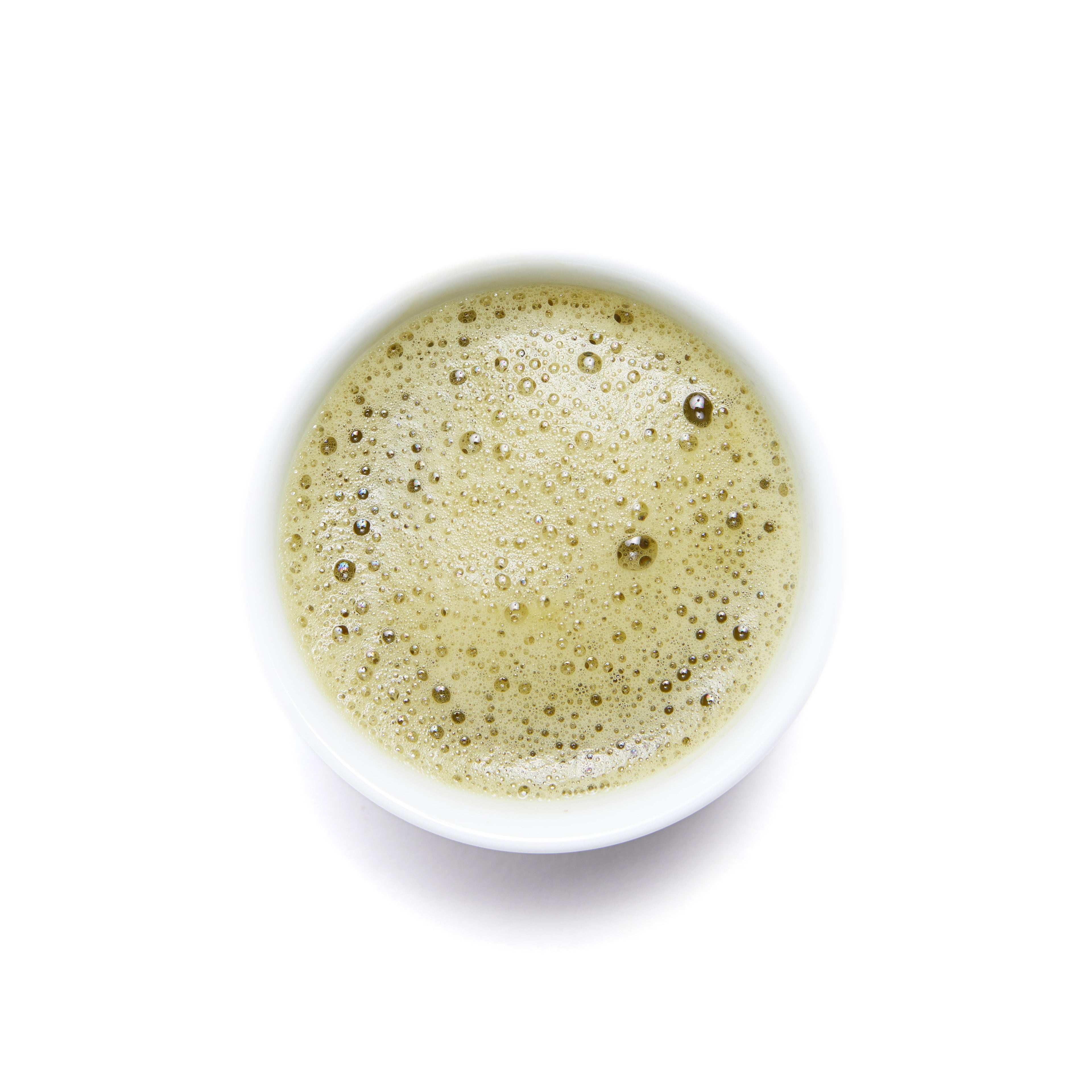 Organic Jeju Latte Matcha powder from Wild Orchard in a clear container with a green tea powder inside.