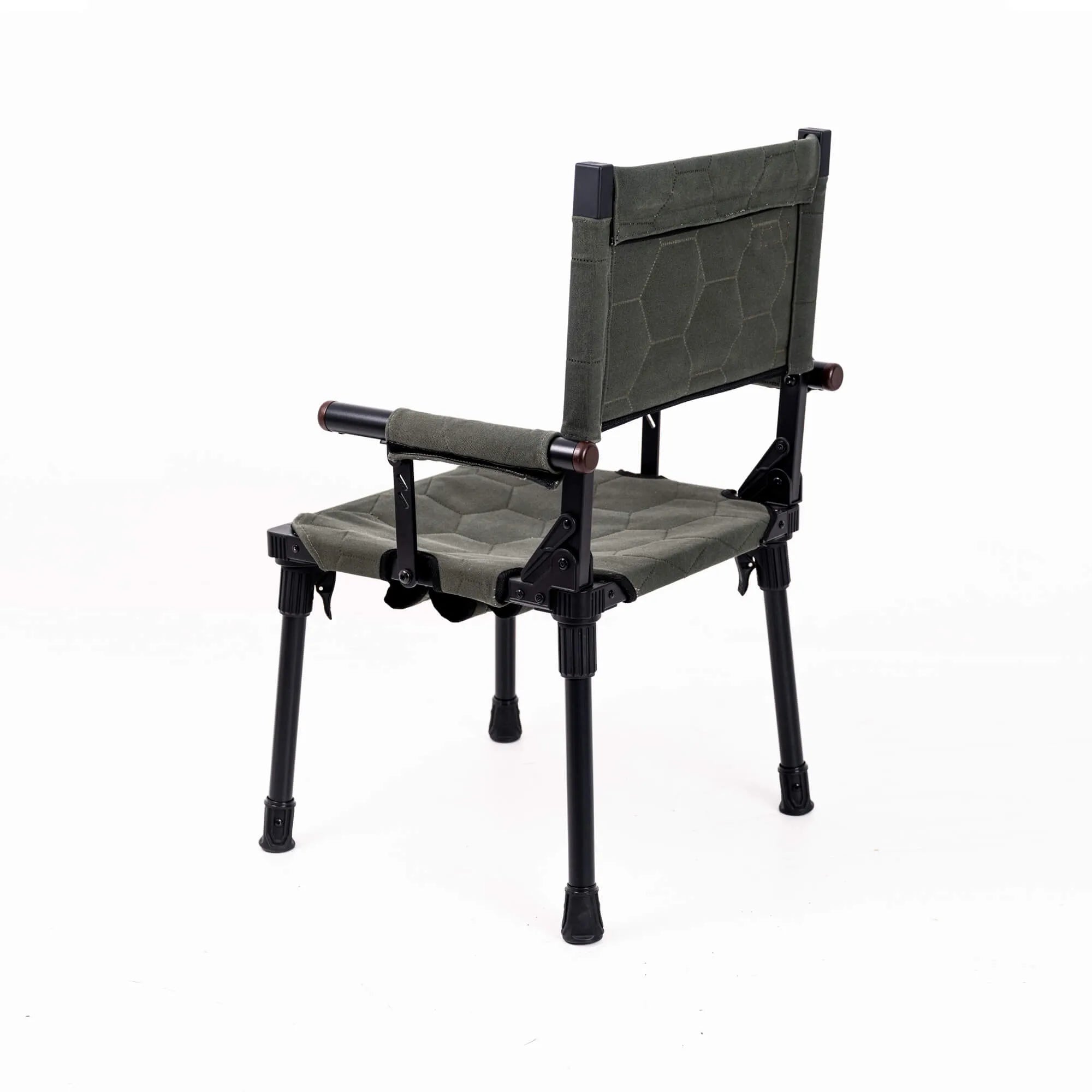 Wild Land MTS-C camping chair with sturdy frame and adjustable armrests, shown in a relaxed outdoor setting.